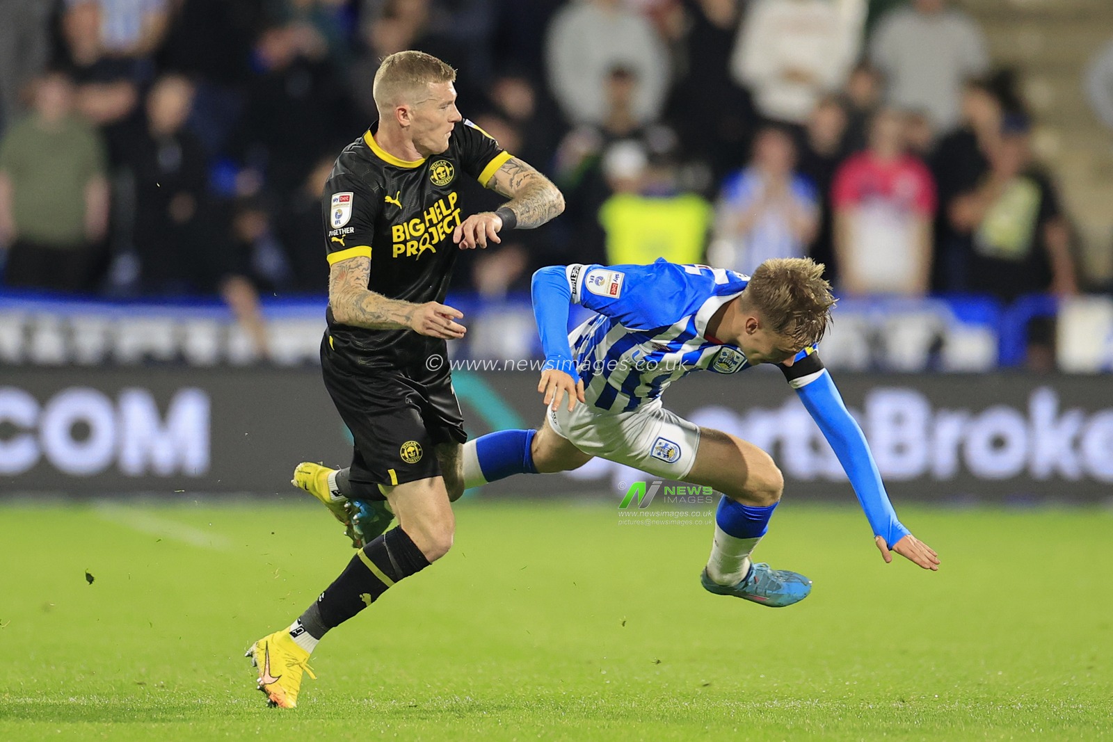 Patrick Jones #26 of Huddersfield Town is fouled by James McClean #11 of Wigan Athletic during the Sky Bet Championship match Huddersfield Town vs Wigan Athletic at John Smith's Stadium, Huddersfield, United Kingdom, 13th September 2022

(Photo by Conor Molloy/News Images)