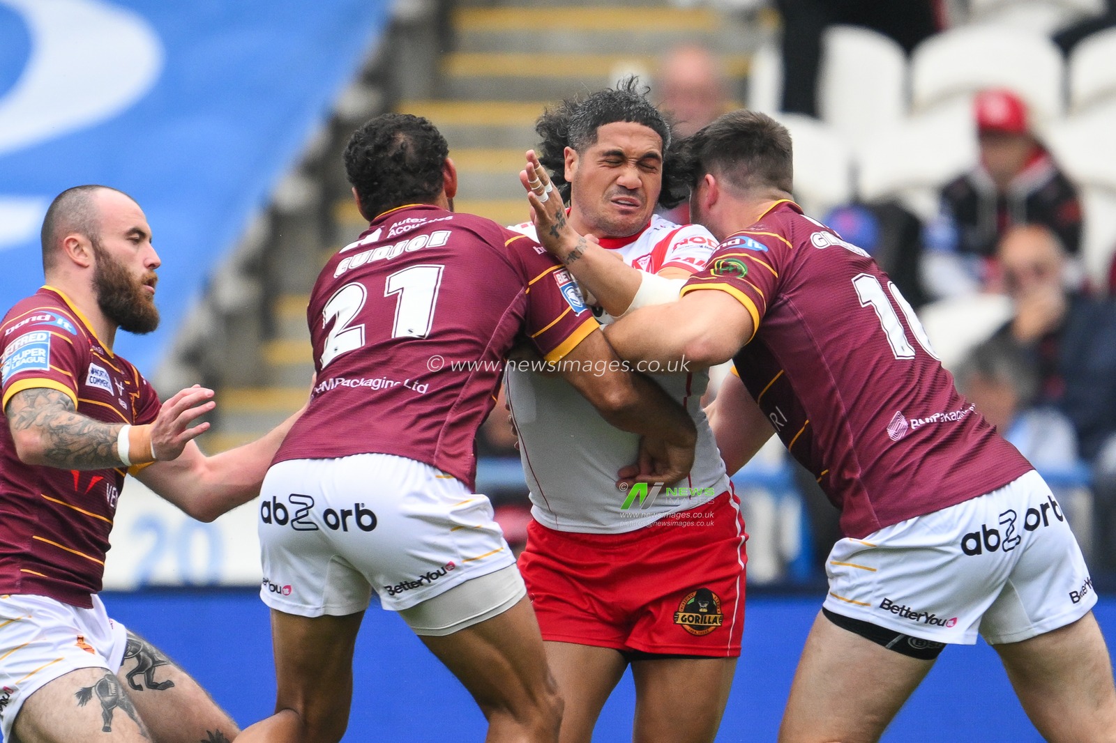 Sione Mataâ€™utia of St. Helens is tackled by Leroy Cudjoe of Huddersfield Giants and Joe Greenwood of Huddersfield Giants during the Betfred Super League Round 24 match Huddersfield Giants vs St Helens at John Smith's Stadium, Huddersfield, United Kingdom, 1st September 2024

(Photo by Craig Thomas/News Images)