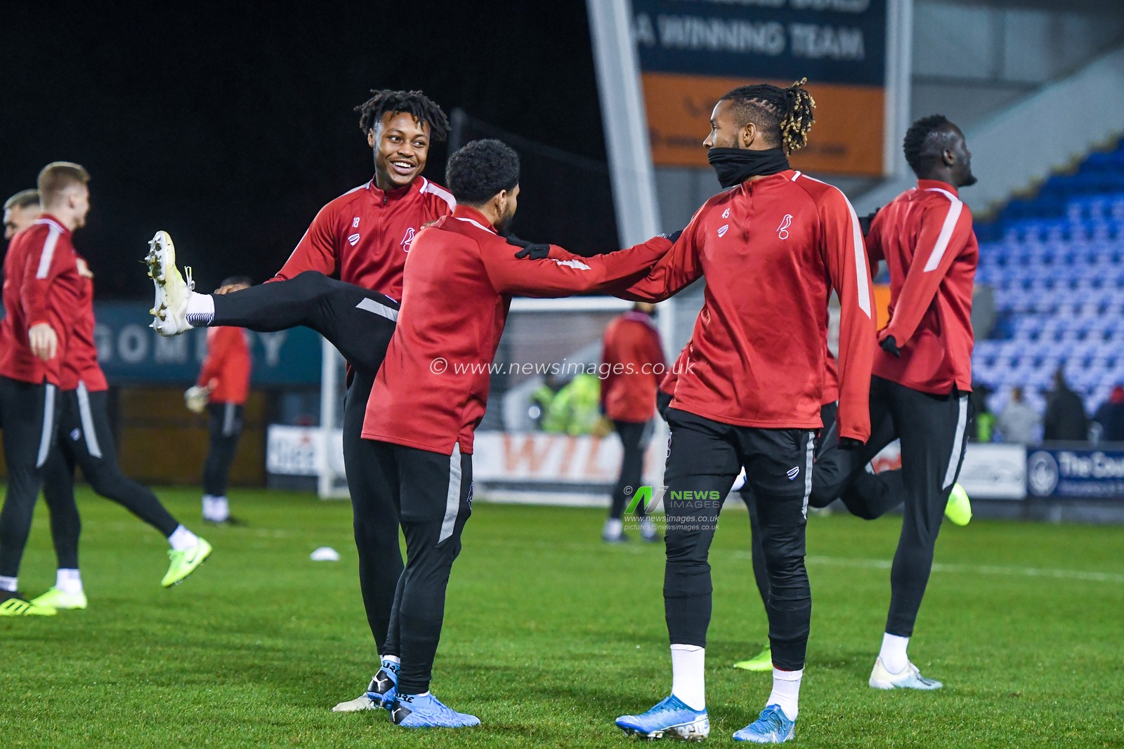 14th January 2020, Greenhous Meadow, Shrewsbury, England; Emirates FA Cup, Shrewsbury Town v Bristol City :
Antoine Semenyo (18) of Bristol City Jay Dasilva (3) of Bristol City and Kasey Palmer (45) of Bristol City all stretch off together and enjoying some jokes between each other.
Credit: Gareth Dalley/News Images