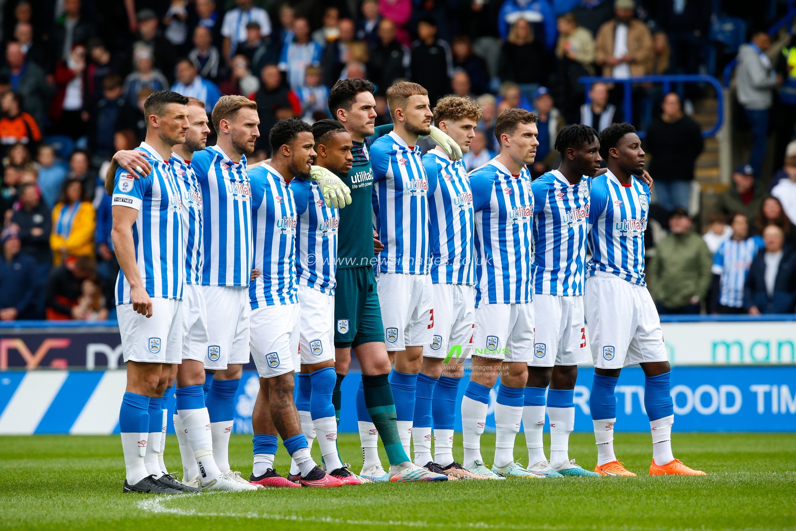 Players of Huddersfield Town stand together as the national anthem is played during the Sky Bet Championship match Huddersfield Town vs Reading at John Smith's Stadium, Huddersfield, United Kingdom, 8th May 2023

(Photo by Ben Early/News Images)