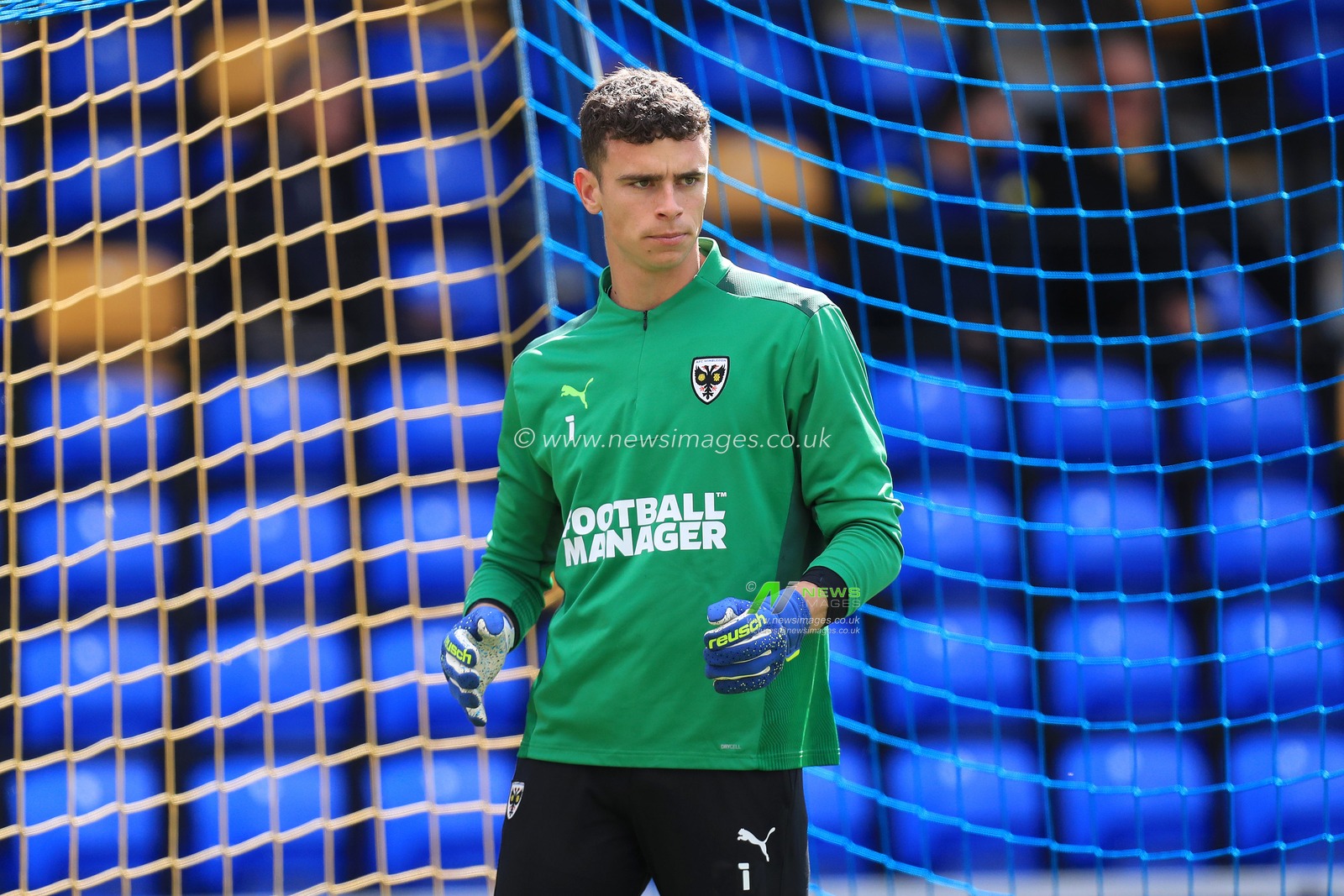 Nik Tzanev #1 of AFC Wimbledon warms up.