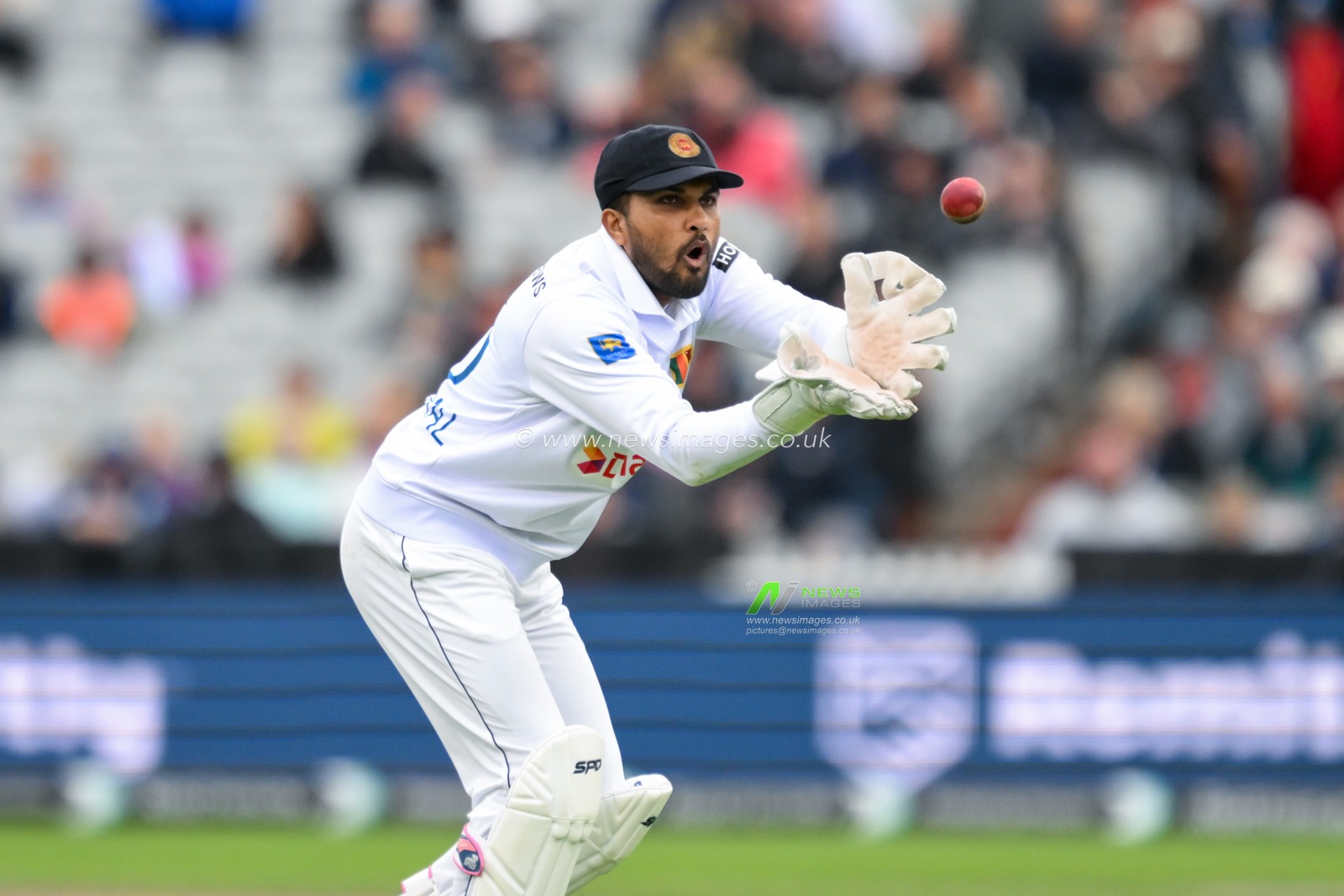 Dinesh Chandimal of Sri Lanka catches the ball during the England Men v Sri Lanka 1st Rothesay Test Match Day 2 at Old Trafford, Manchester, United Kingdom, 22nd August 2024

(Photo by Craig Thomas/News Images)