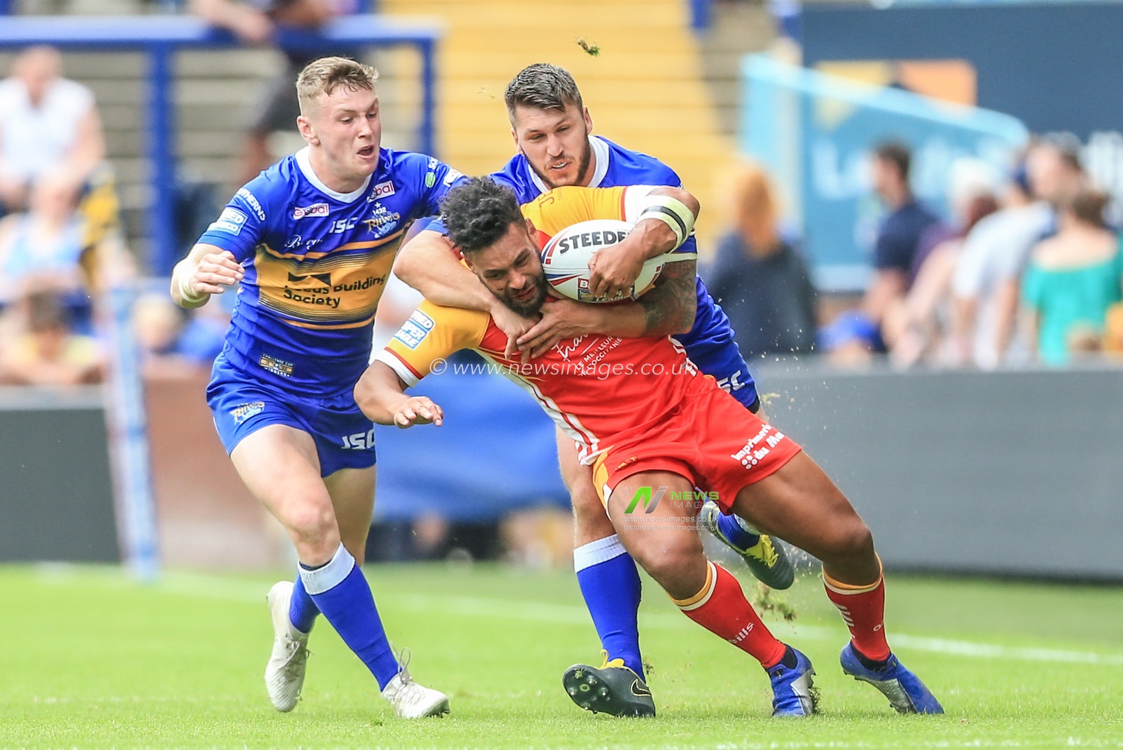 30th June 2019 , Emerald Headingley Stadium, England; Betfred Super League, Round 20, Leeds Rhinos vs Catalans Dragons ; Jodie Broughton (2) of Catalans Dragons is tackled by Tom Briscoe (2) of Leeds Rhinos 


Credit: Mark Cosgrove/News Images