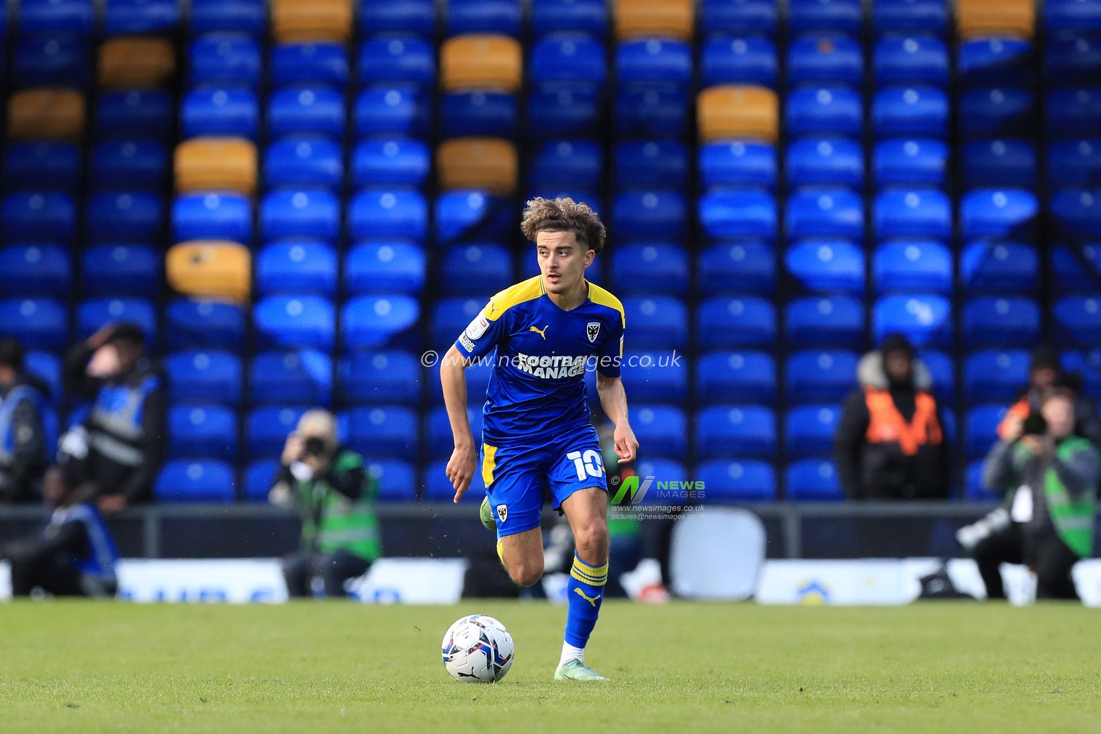 Ayoub Assal #10 of AFC Wimbledon dribbling with the ball.