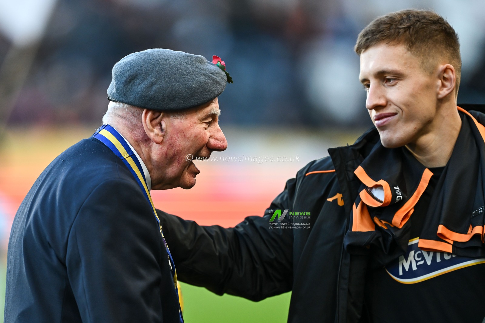Greg Docherty #8 of Hull City speaks to a war veteran ahead of the Sky Bet Championship match Hull City vs Huddersfield Town at MKM Stadium, Hull, United Kingdom, 11th November 2023

(Photo by Craig Thomas/News Images)