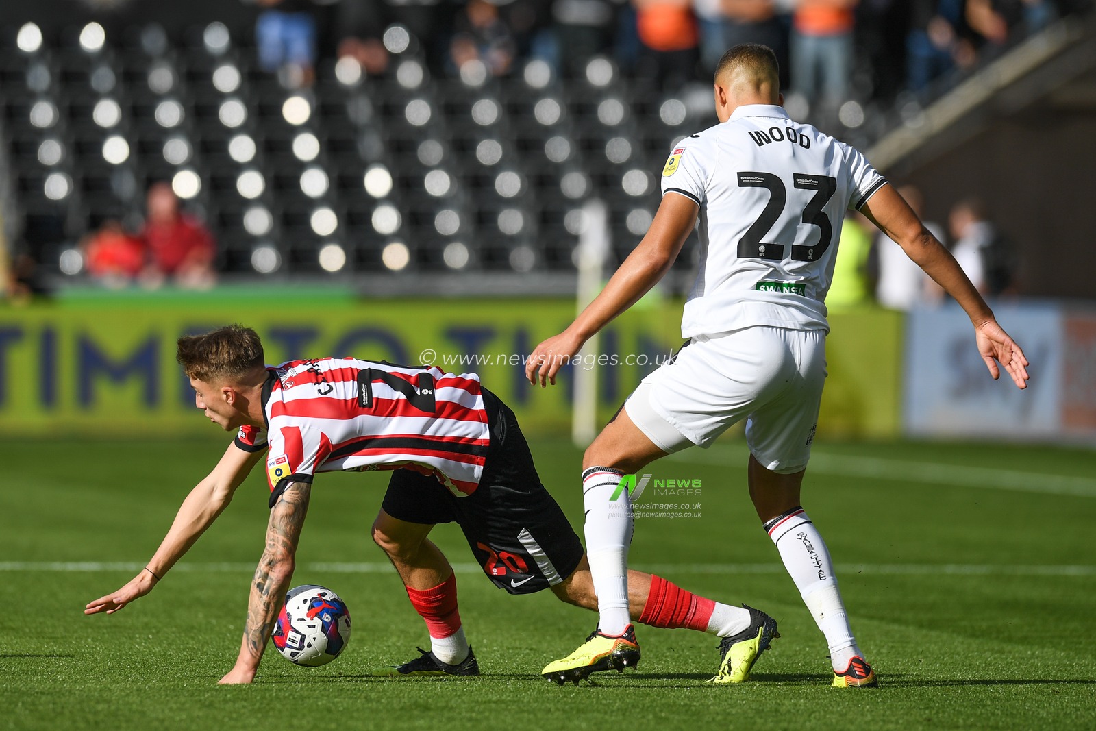 Jack Clarke #20 of Sunderland Under pressure from Nathan Wood #23 of Swansea City during the Sky Bet Championship match Swansea City vs Sunderland at Swansea.com Stadium, Swansea, United Kingdom, 8th October 2022

(Photo by Mike Jones/News Images)