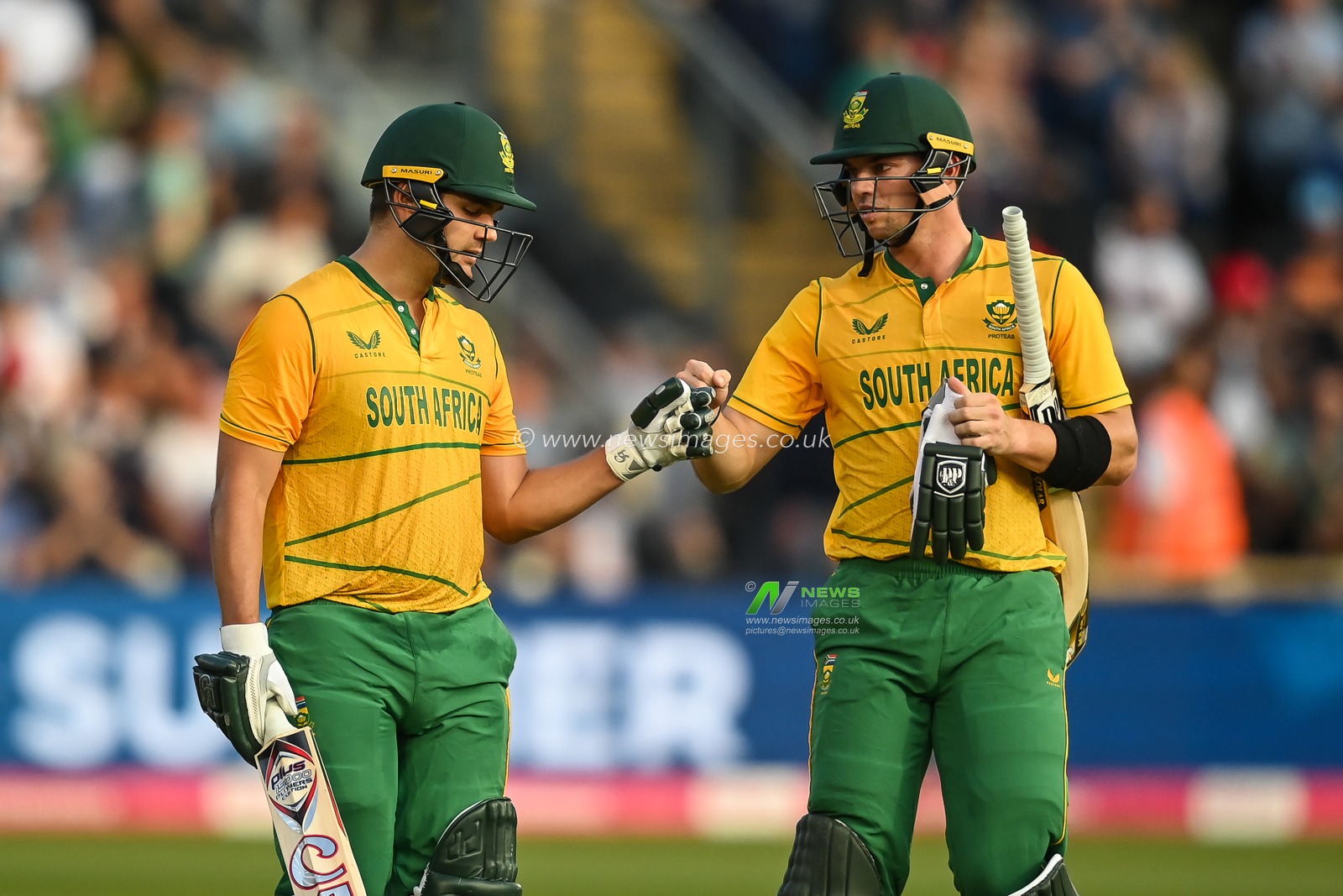 Tristan Stubbs of South Africa and Rilee Rossouw bumps fists as they leave the field after scoring 207 run