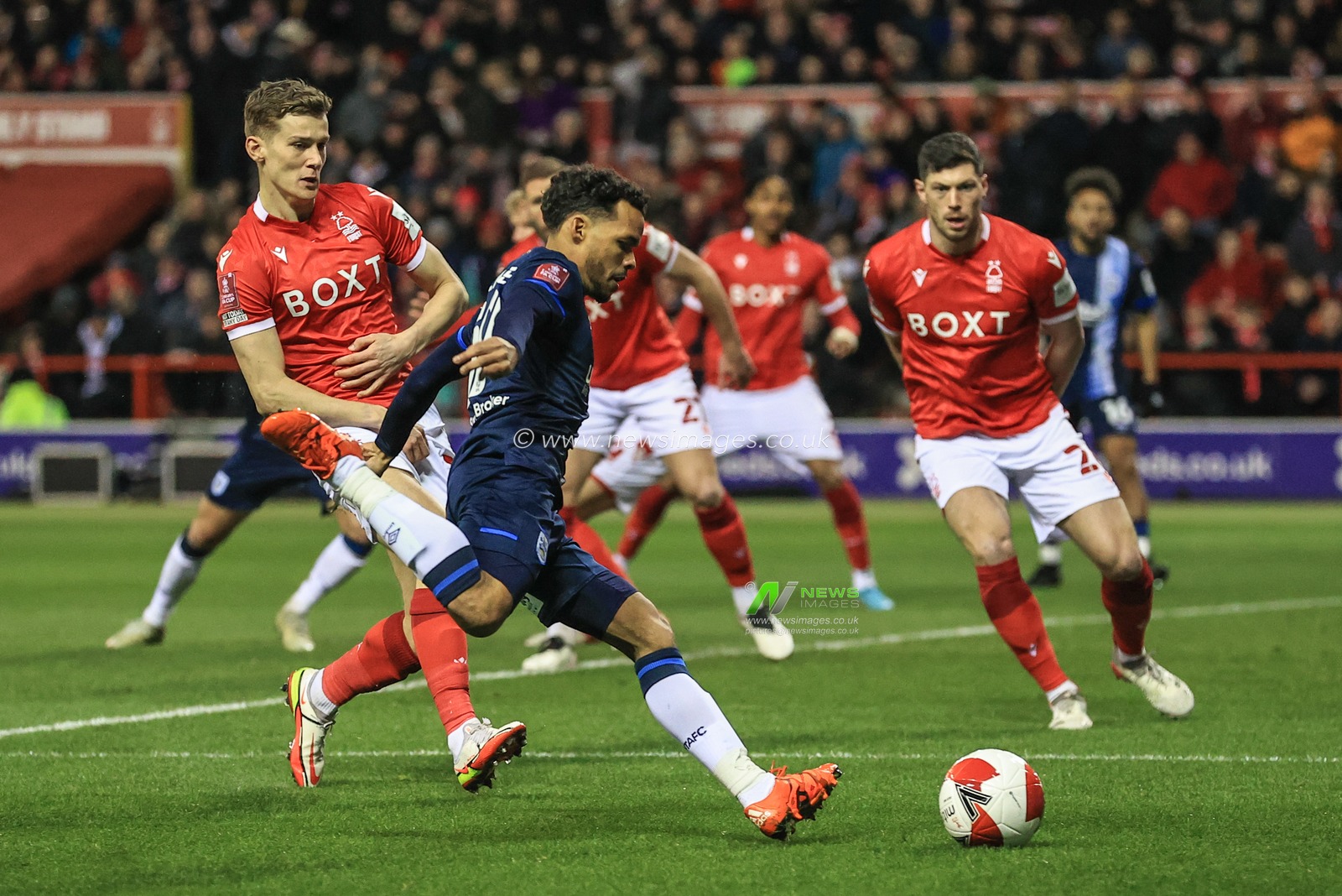 Duane Holmes #19 of Huddersfield Town crosses the ball