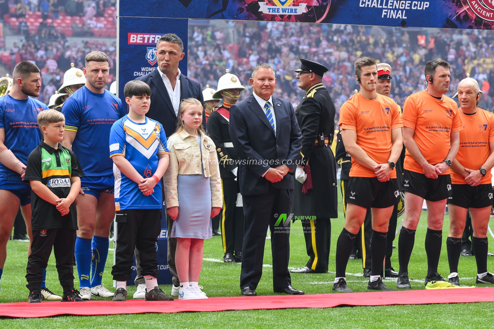 Players line up ahead of the National Anthem during the Betfred Challenge Cup Final match Warrington Wolves vs Wigan Warriors at Wembley Stadium, London, United Kingdom, 8th June 2024

(Photo by Craig Thomas/News Images)
