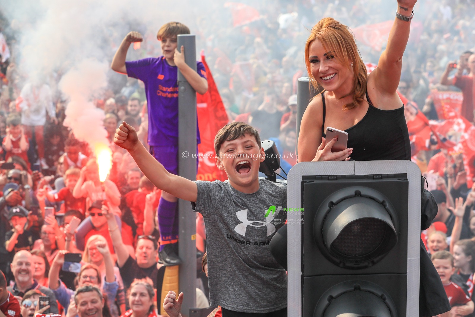 2nd June 2019 , Liverpool, England; UEFA Champions League, Liverpool FC Champions League winners celebrations and open top bus parade ; Liverpool fans line the streets to welcome home their heroes after winning the European Cup for the sixth time 

Credit: Mark Cosgrove/News Images