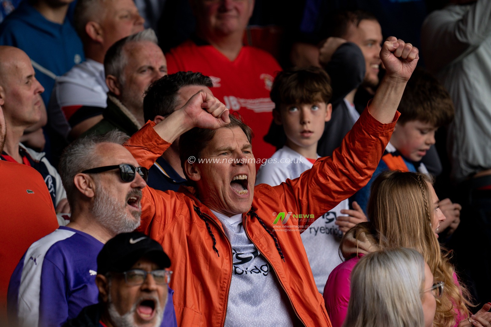 Fans celebrate winning the game 1:0 and making the play offs