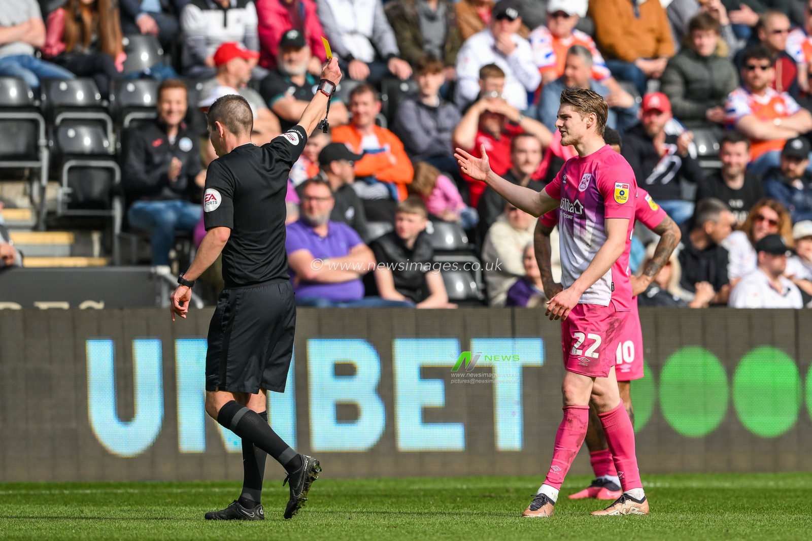 Referee Matthew Donohue gives a yellow card to Jack Rudoni #22 of Huddersfield Town during the Sky Bet Championship match Swansea City vs Huddersfield Town at Swansea.com Stadium, Swansea, United Kingdom, 15th April 2023

(Photo by Craig Thomas/News Images)