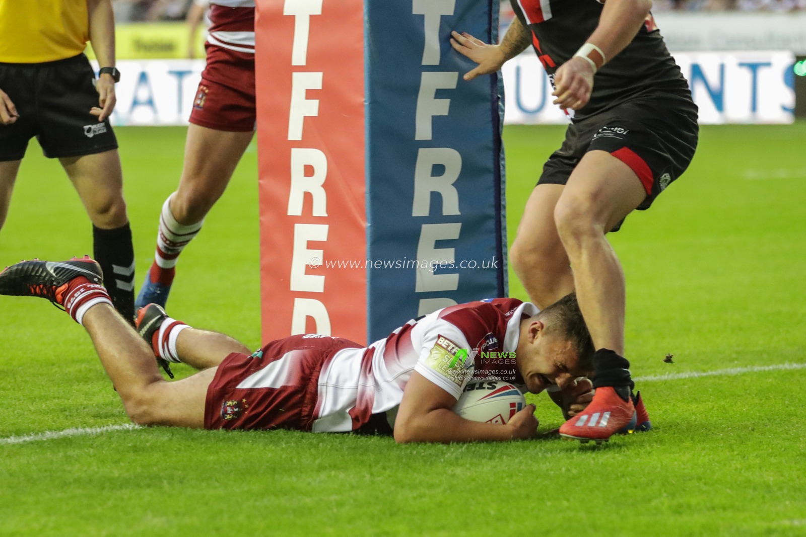 28th June 2019 , DW Stadium, Wigan, England;  Betfred Super League, Round 20, Wigan Warriors vs Salford Red Devils ; Oliver Partington (24) of Wigan Warriors goes over for a match winning try 

Credit: Mark Cosgrove/News Images