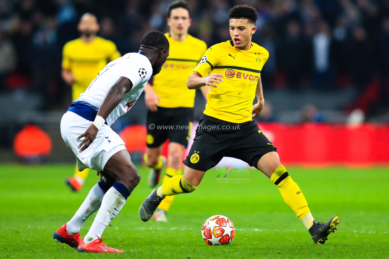 13th February 2019, Wembley Stadium, London, England; UEFA Champions League, Round of 16, Tottenham vs Borussia Dortmund ; Jadon Sancho (07) of Borussia Dortmund tries to get round Moussa Sissoko (17) of Tottenham 


Credit: Georgie Kerr/News Images