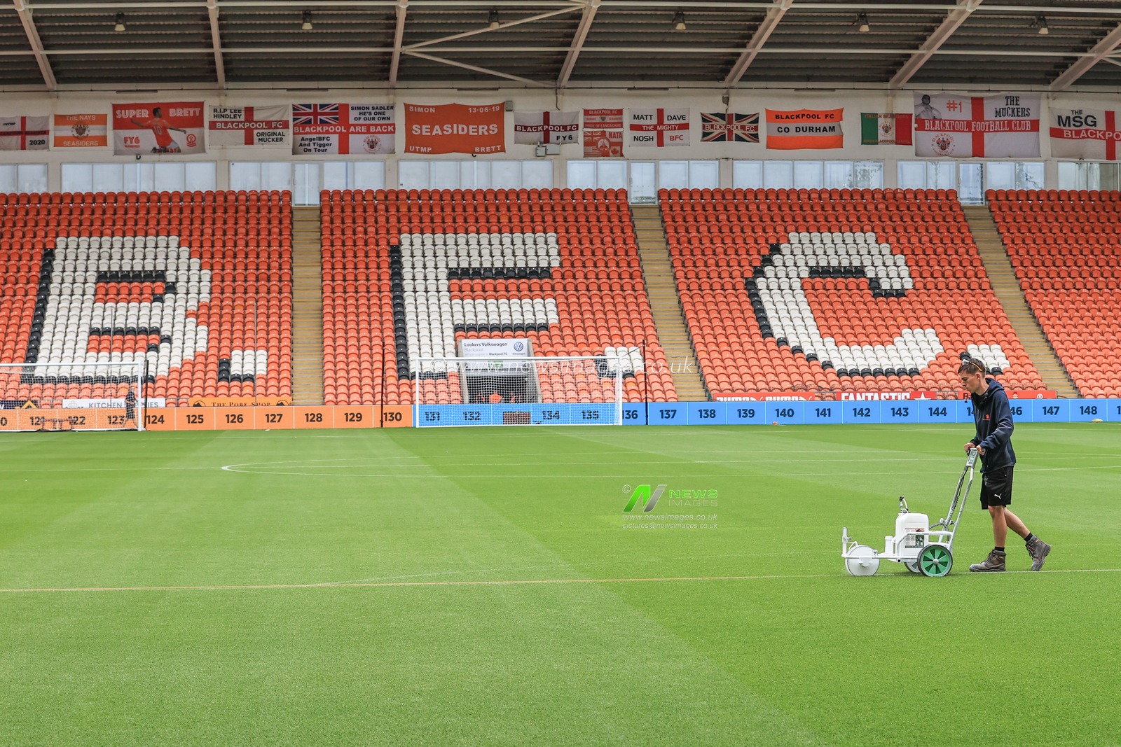 Ground staff prepare the pitch for this afternoons Sky Bet Championship game, Blackpool v Cardiff City