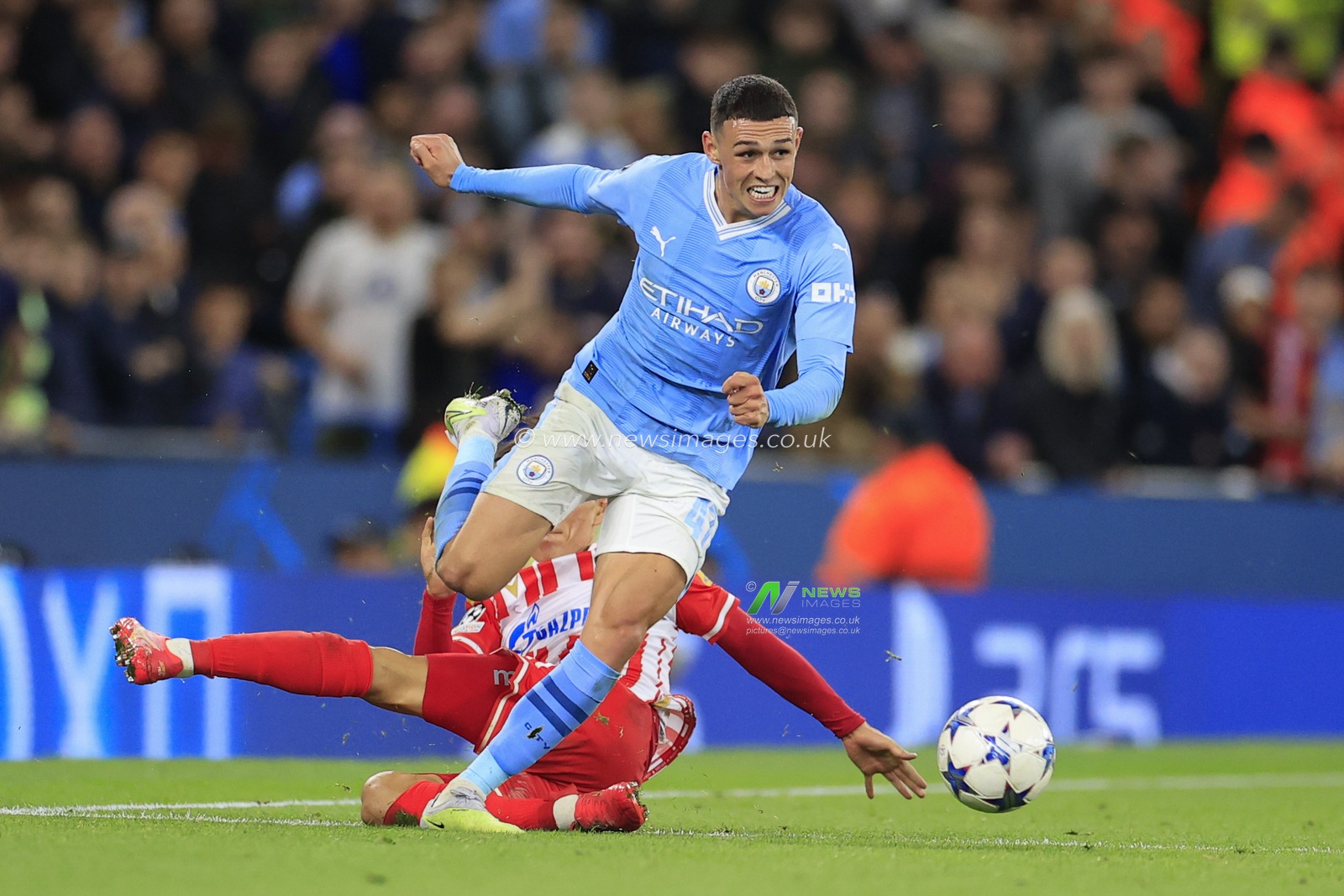 Phil Foden #47 of Manchester City is challenged by In-beom Hwang #66 of Red Star Belgrade during the UEFA Champions League match Manchester City vs Red Star Belgrade at Etihad Stadium, Manchester, United Kingdom, 19th September 2023

(Photo by Conor Molloy/News Images)