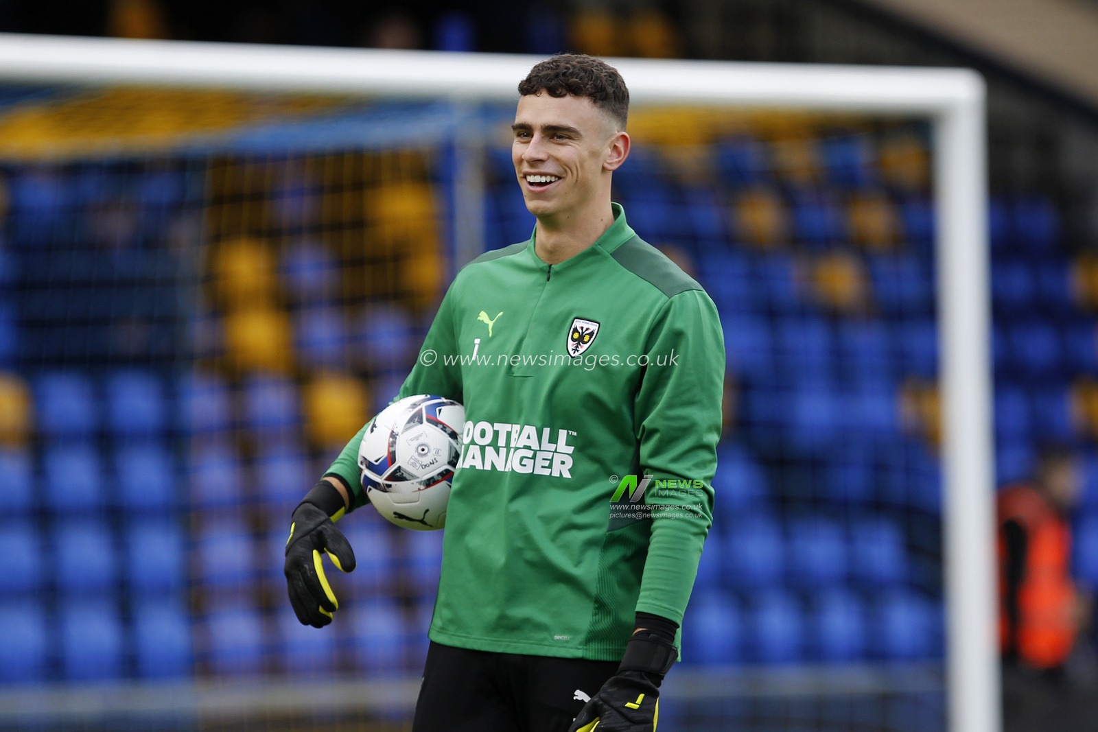 Nik Tzanev #1 of AFC Wimbledon lagging