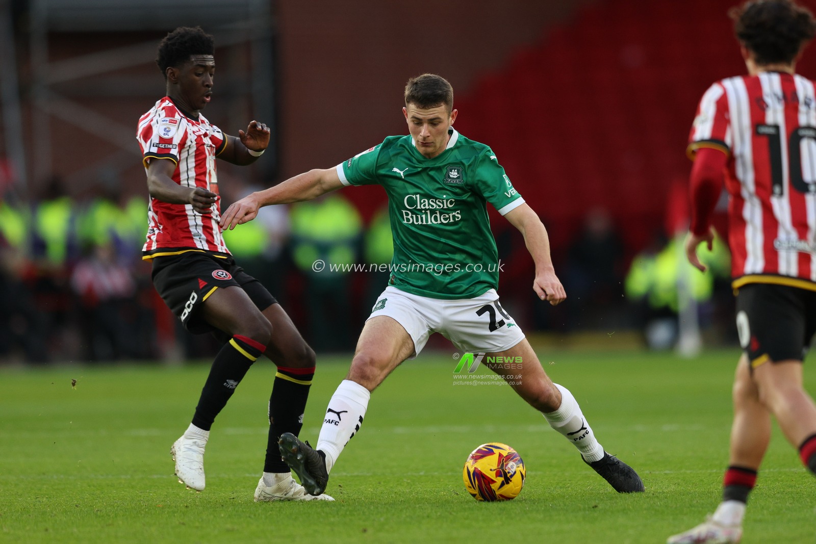 Adam Randell of Plymouth Argyle holds off Jesuran Rak-Sakyi of Sheffield United during the Sky Bet Championship match Sheffield United vs Plymouth Argyle at Bramall Lane, Sheffield, United Kingdom, 14th December 2024

(Photo by Alex Roebuck/News Images)