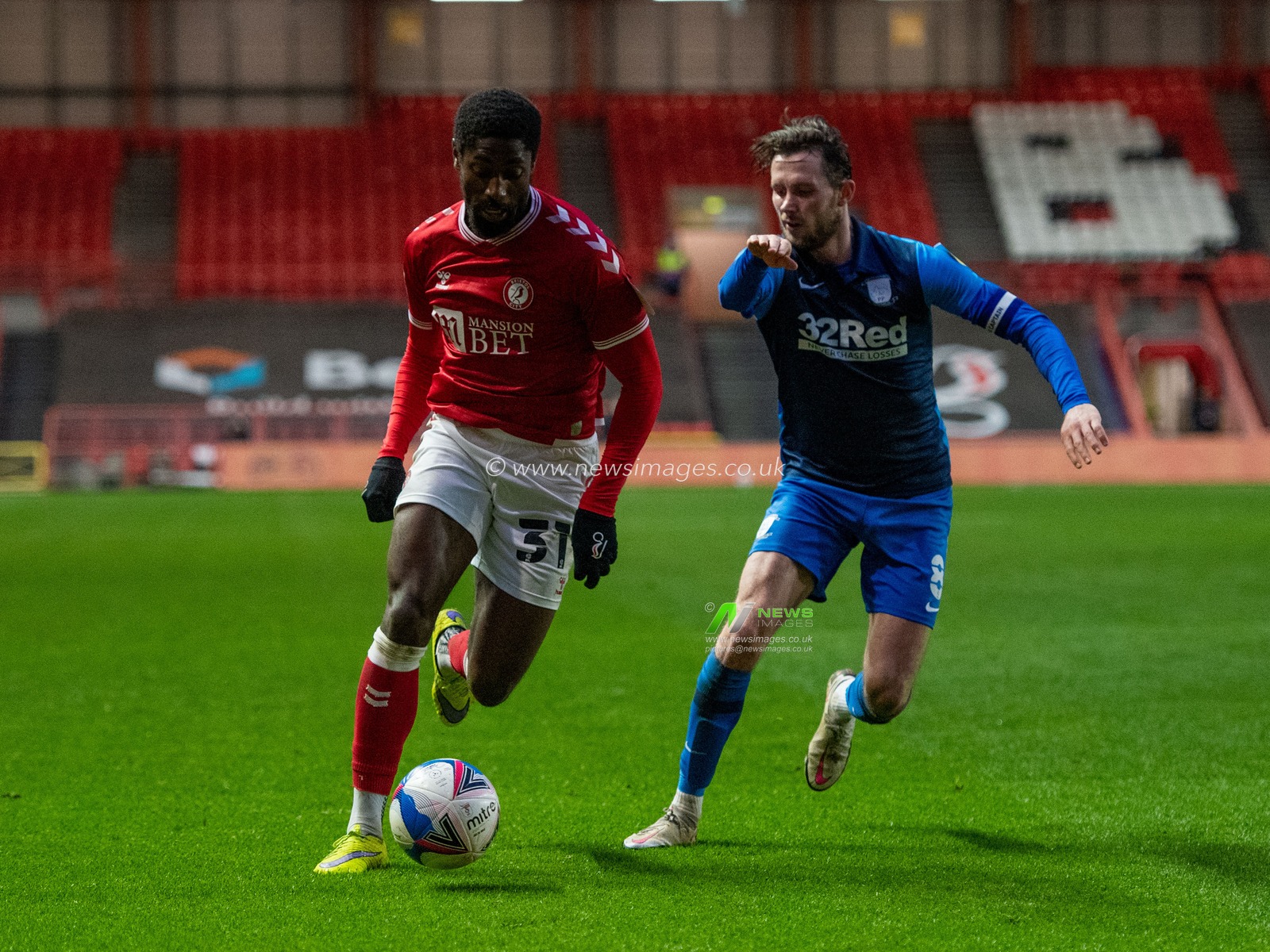 Hakeeb Adelakun #31 of Bristol City runs towards the Preston North End goal under pressure from Alan Browne #8 of Preston North End