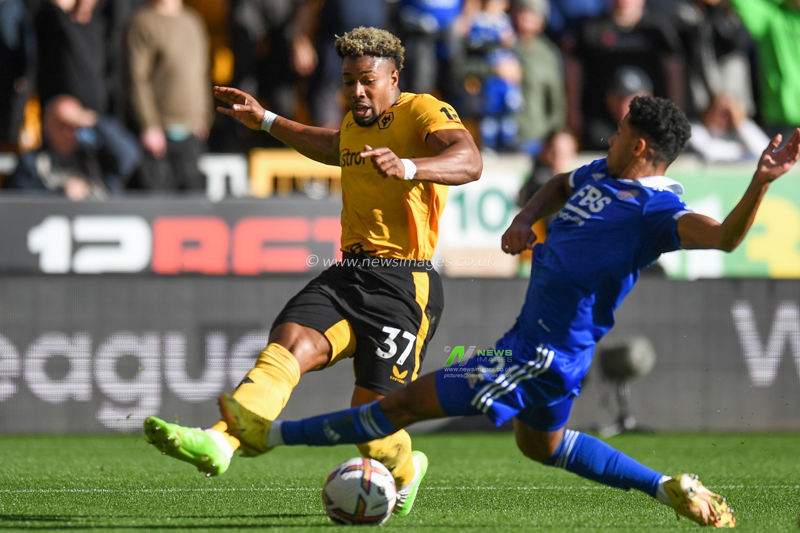 Adama TraorÃ© #37 of Wolverhampton Wanderers tackled by James Justin #2 of Leicester City  during the Premier League match Wolverhampton Wanderers vs Leicester City at Molineux, Wolverhampton, United Kingdom, 23rd October 2022

(Photo by Mike Jones/News Images)