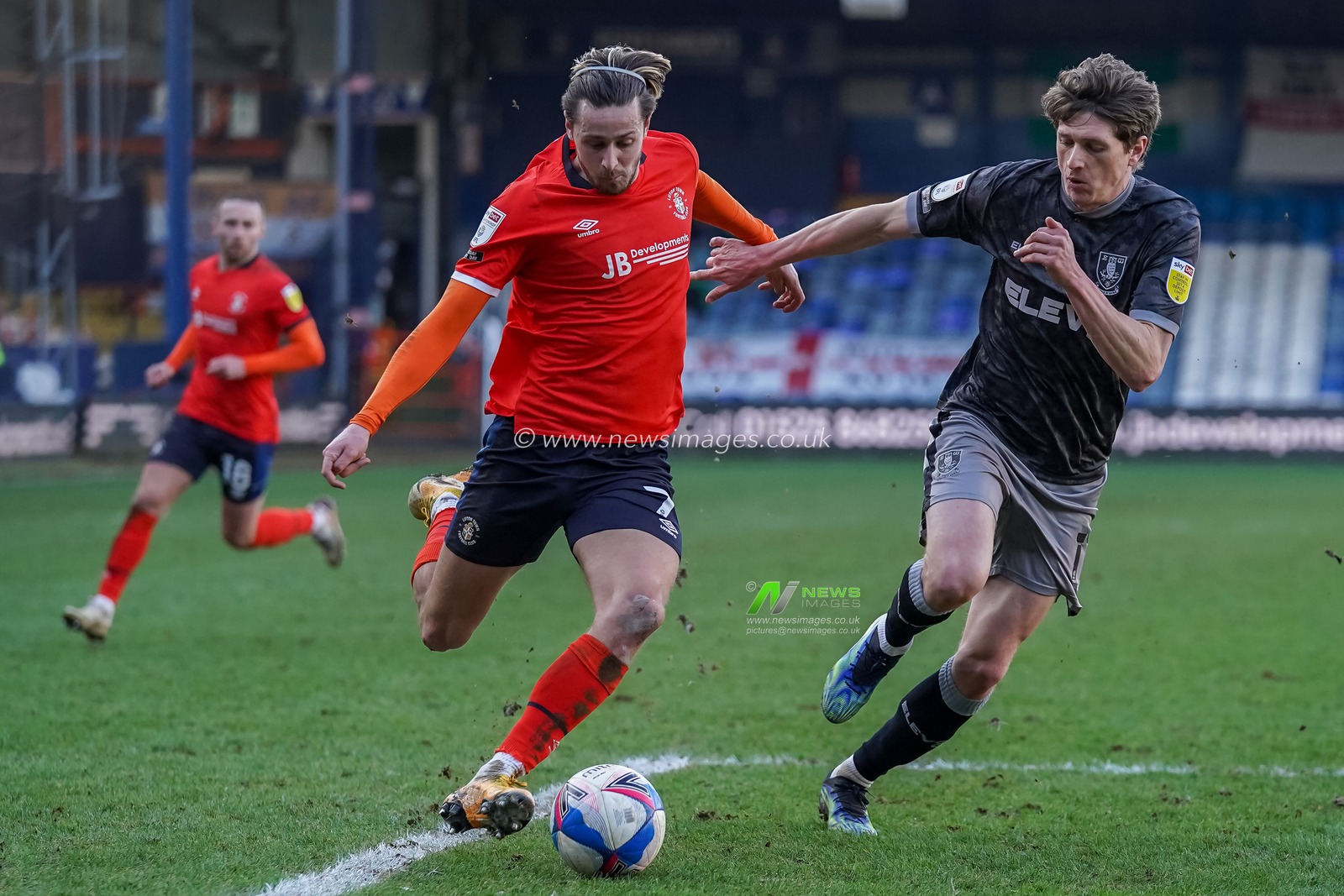 Harry Cornick #7 of Luton Town battles with Adam Reach #11 of Sheffield Wednesday