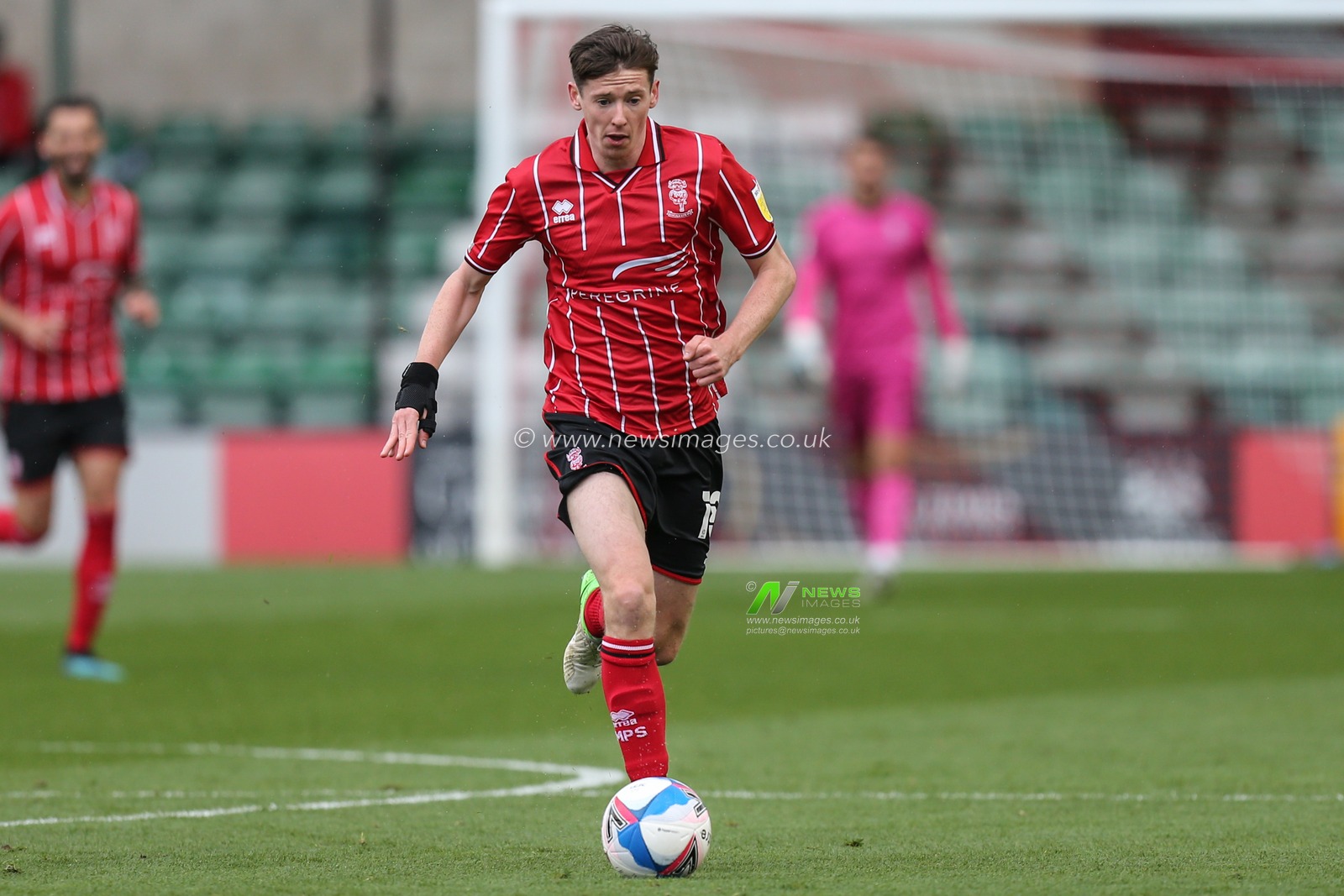 Conor McGrandles (18) of Lincoln City match image