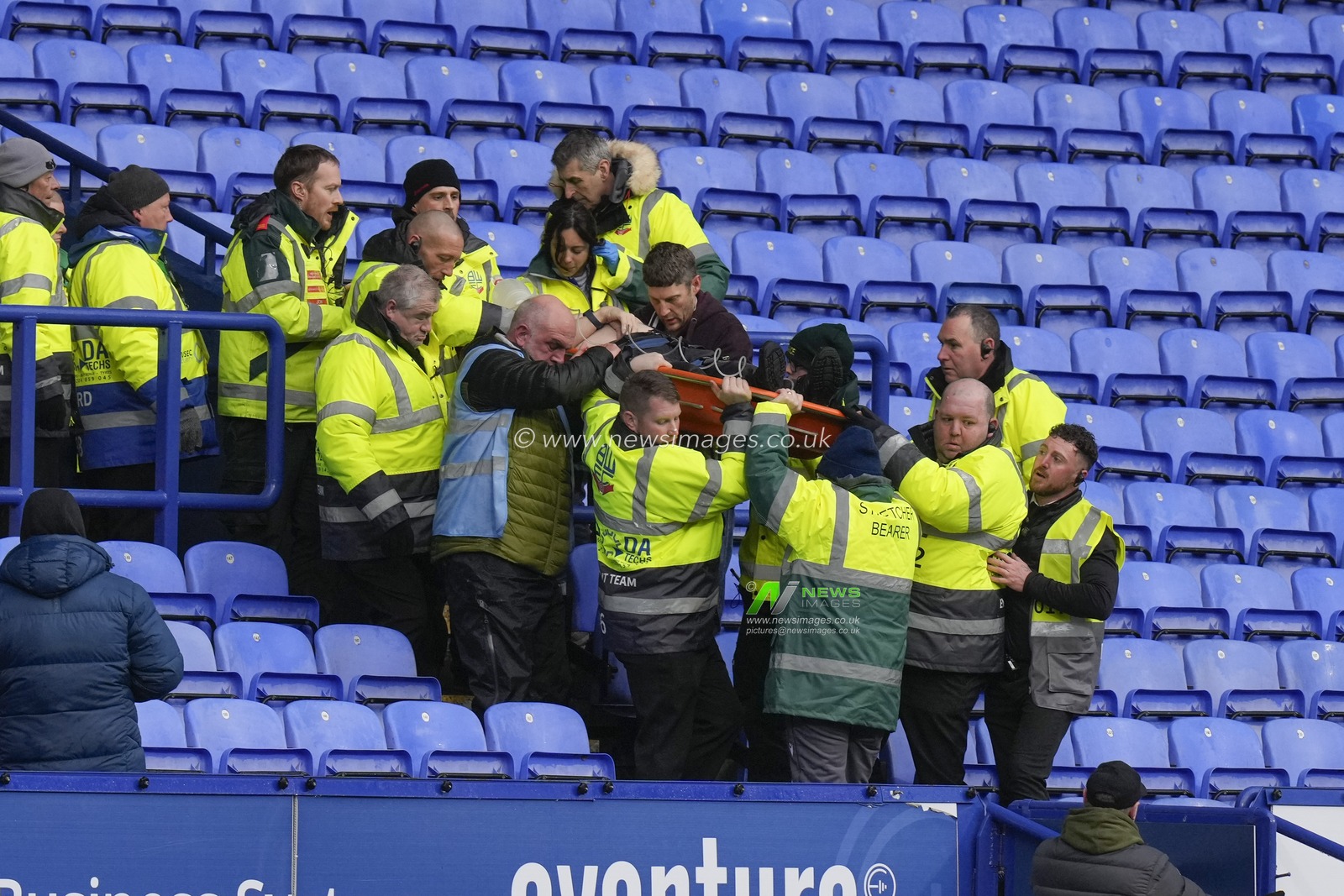 Stewards and Paramedics lift a stretcher down from the stand during a medical emergency during the Sky Bet League 1 match Bolton Wanderers vs Cheltenham Town at Toughsheet Community Stadium, Bolton, United Kingdom, 13th January 2024

(Photo by Steve Flynn/News Images)
