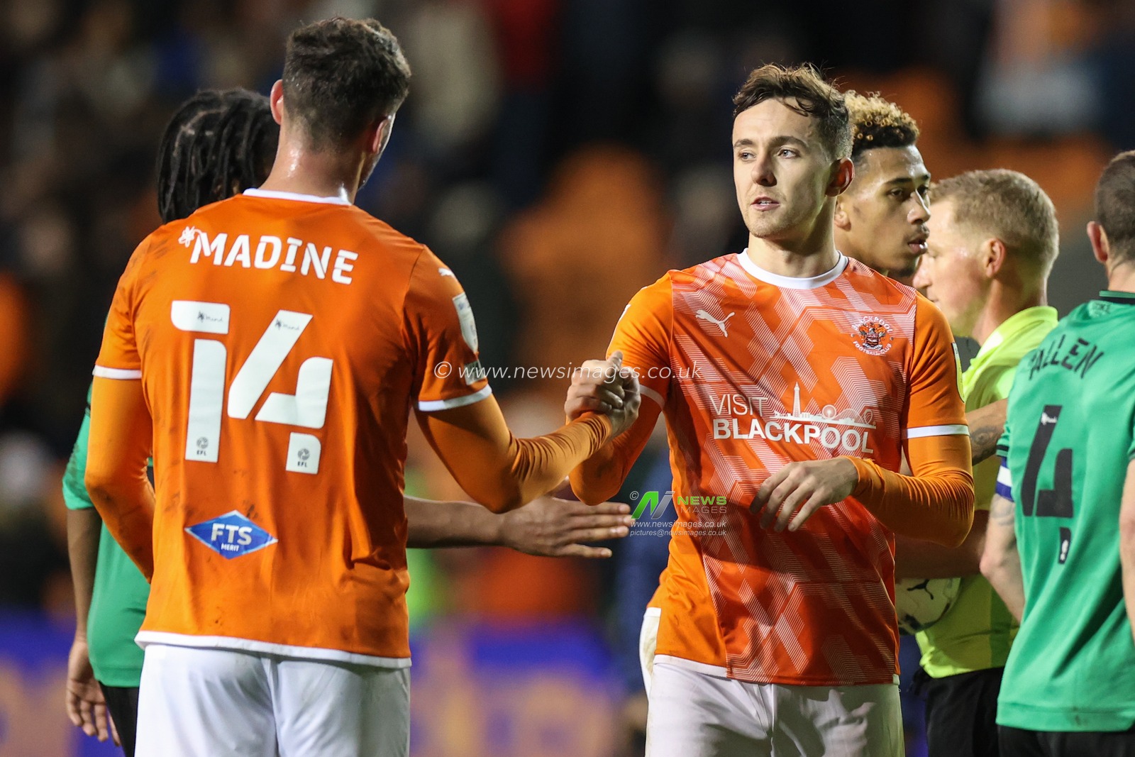 Gary Madine #14 of Blackpool and Ryan Wintle #8 of Blackpool shakes hands
