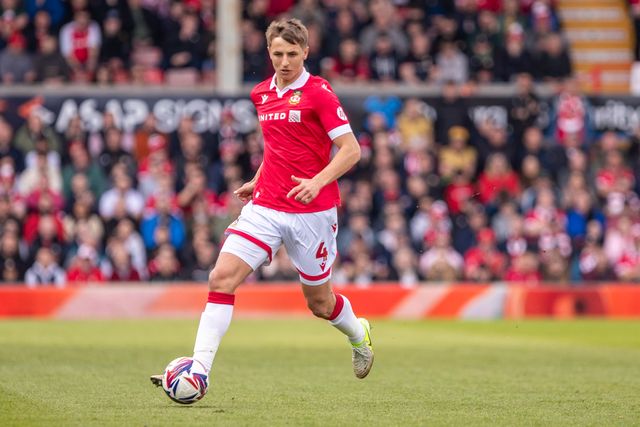 Wrexham's Max Cleworth carries the ball during the Sky Bet League 1 match Wrexham vs Stockport County at SToK Cae Ras, Wrexham, United Kingdom, 22nd March 2025

(Photo by Nik Mesney/News Images)