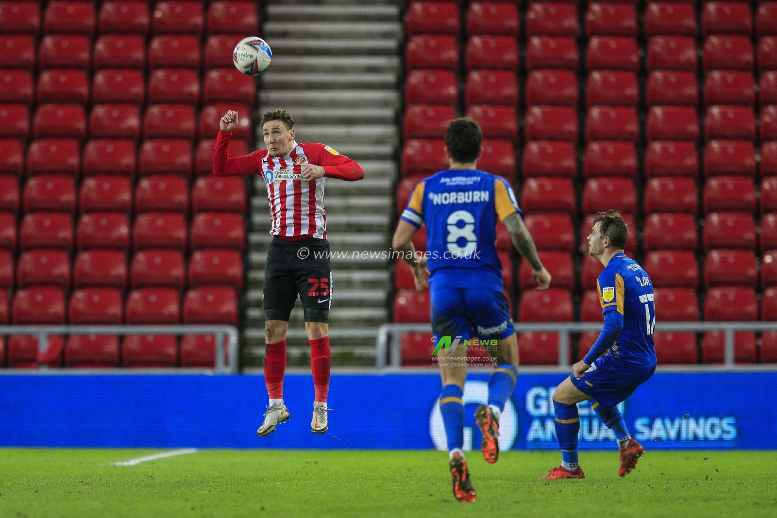 Callum McFadzean #25 of Sunderland heads the ball out of his own penalty area