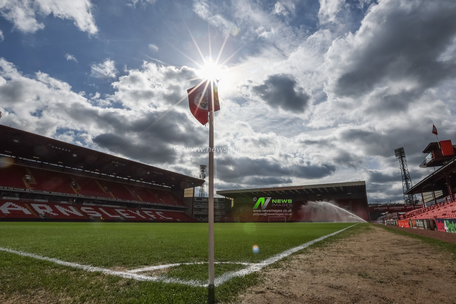 A general view of Oakwell as the sunbursts over the corner flag during the Sky Bet League 1 match Barnsley vs Cheltenham Town at Oakwell, Barnsley, United Kingdom, 16th March 2024

(Photo by Mark Cosgrove/News Images)