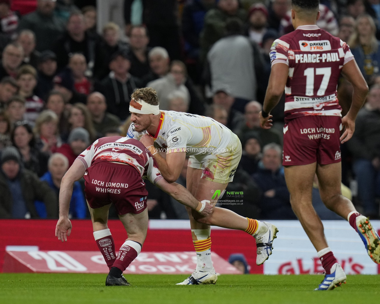 Paul Seguier #12 of Catalans Dragons runs at Harry Smith #7 of Wigan Warriors during the Betfred Super League Grand Final match Wigan Warriors vs Catalans Dragons at Old Trafford, Manchester, United Kingdom, 14th October 2023

(Photo by Steve Flynn/News Images)