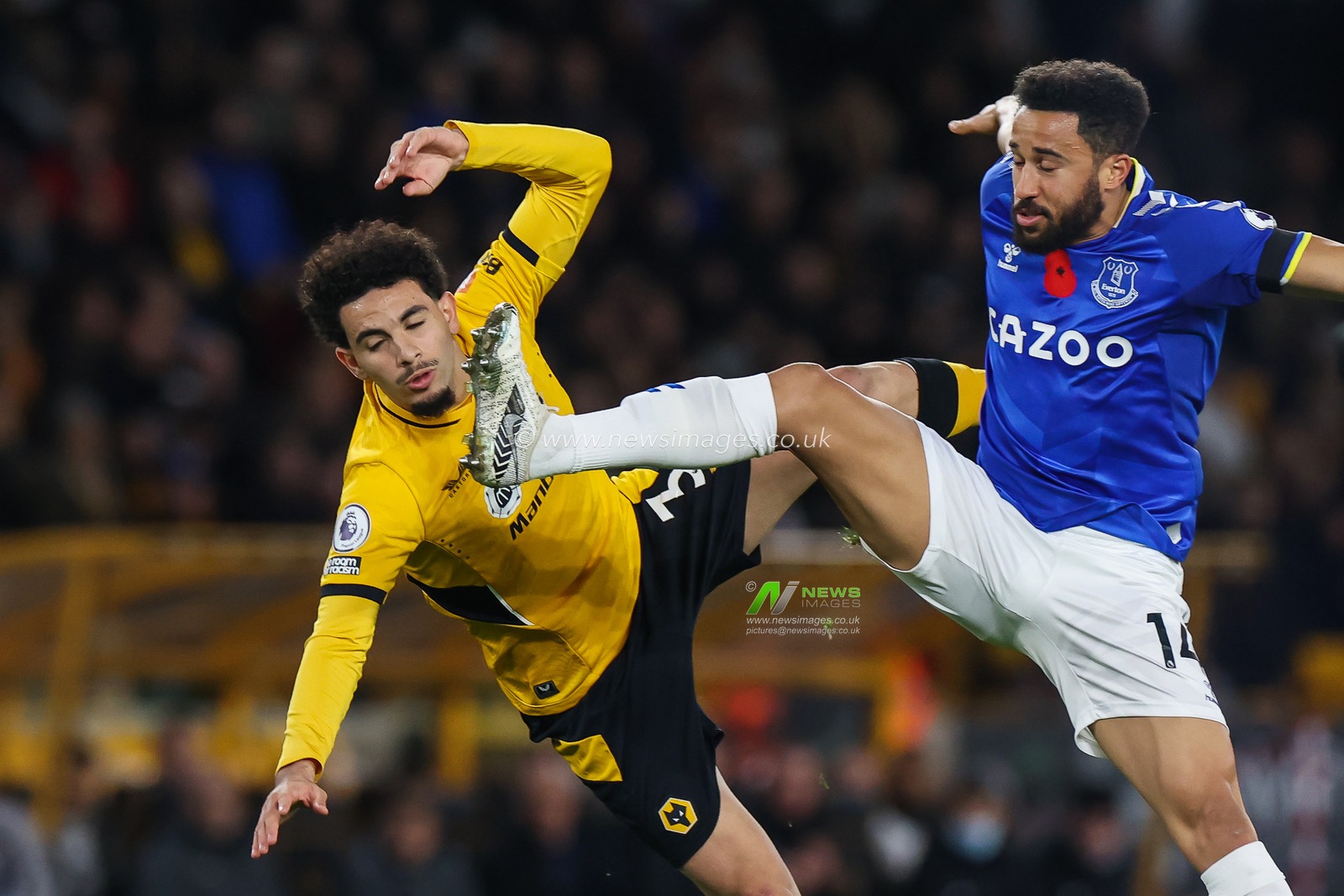 Rayan Ait-Nouri #3 of Wolverhampton Wanderers tangle while battling for the ball