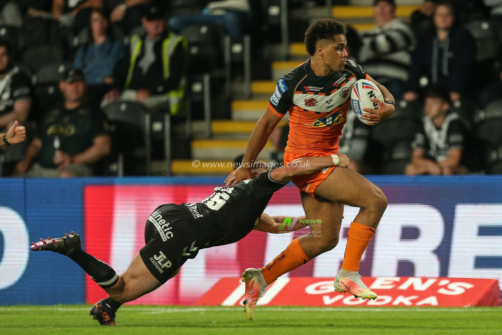 Derrell Olpherts #2 of Castleford Tigers runs to the try line to complete his hat-trick of tries