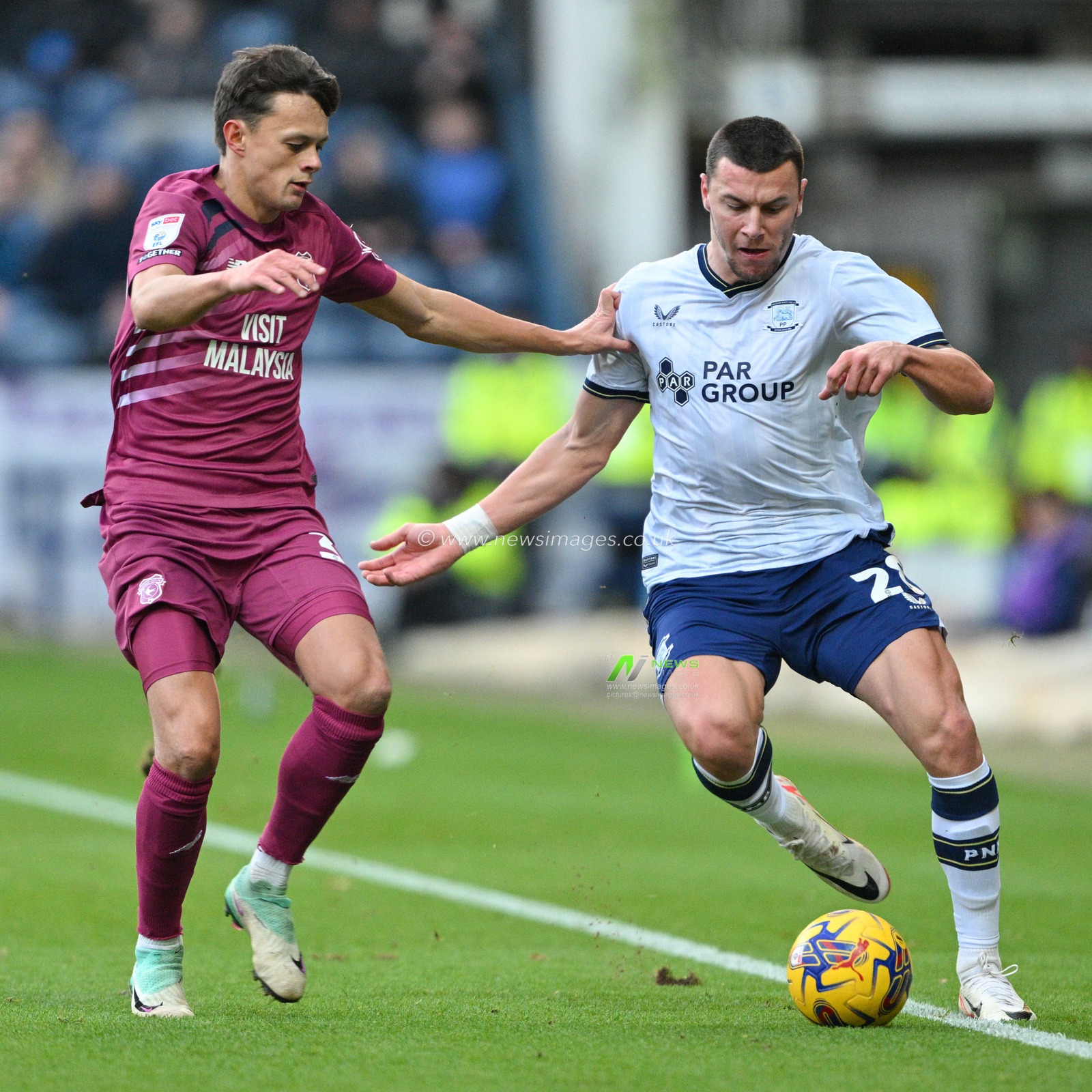 Milutin OsmajiÄ‡ 28# of Preston North End Football Club and Perry Ng 38# of Cardiff City Association Football Club chases down the ball, during the Sky Bet Championship match Preston North End vs Cardiff City at Deepdale, Preston, United Kingdom, 25th November 2023

(Photo by Cody Froggatt/News Images)