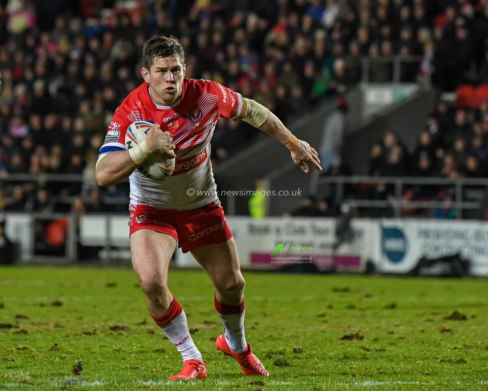 Louie McCarthy-Scarsbrook #15 of St Helens with the ball