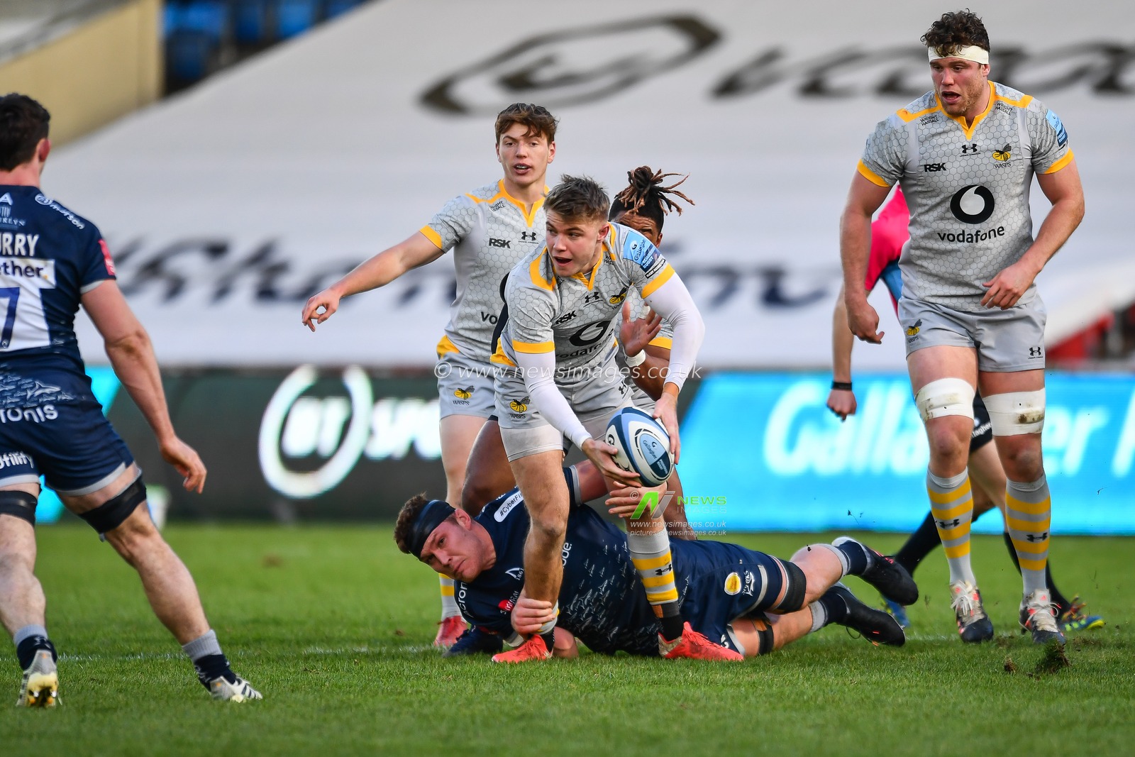 Charlie Atkinson of Wasps is tackled by Jean-Luc du Preez of Sale Sharks