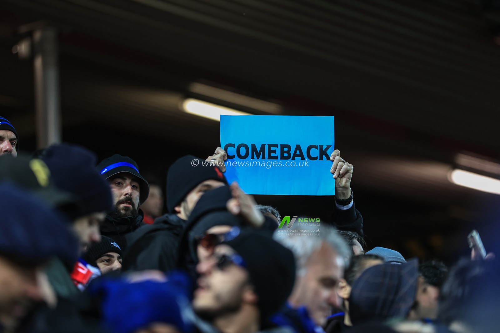 A Inter Milan fan holds a â€˜Comebackâ€™ banner up