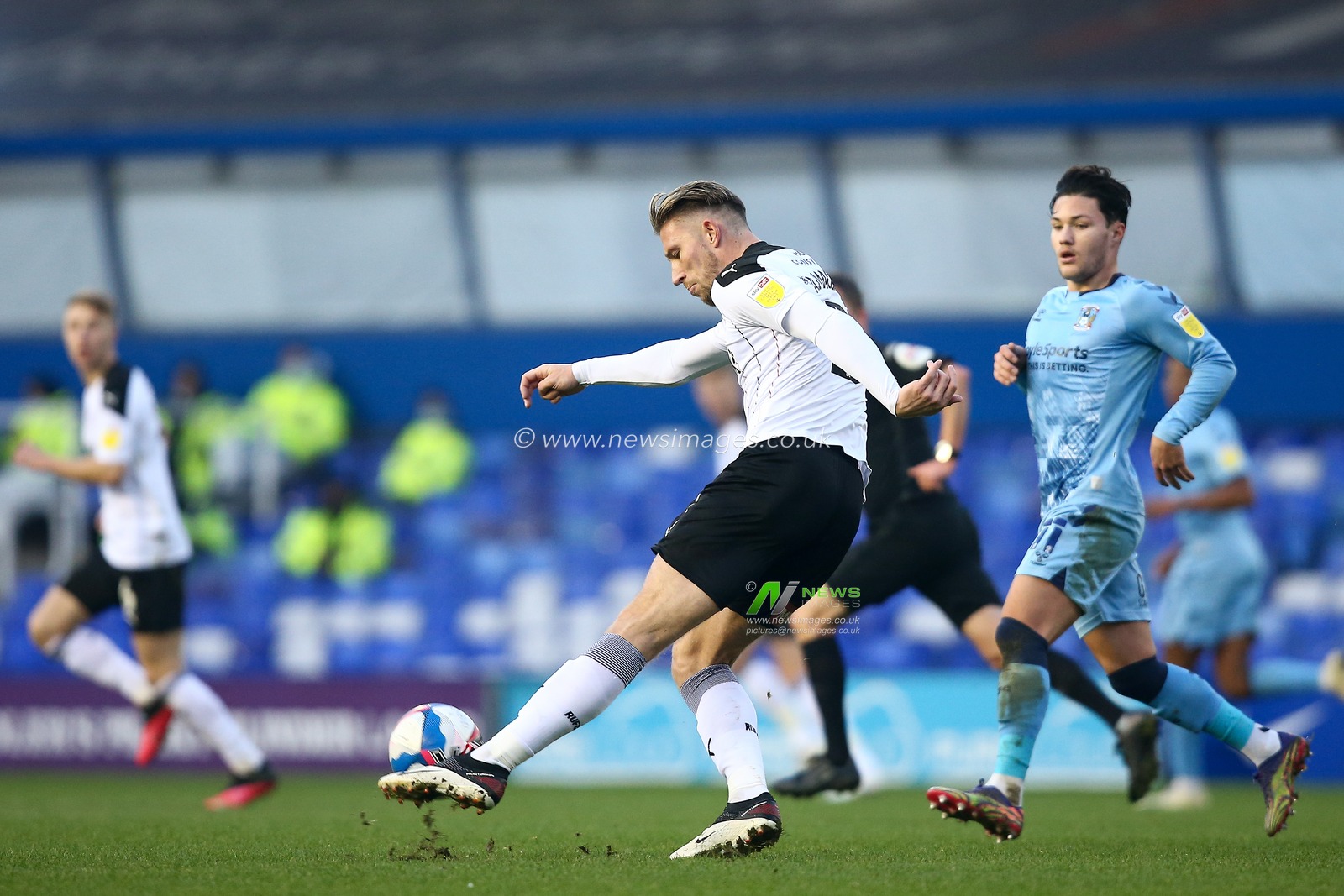 Angus MacDonald #21 of Rotherham United clears the ball