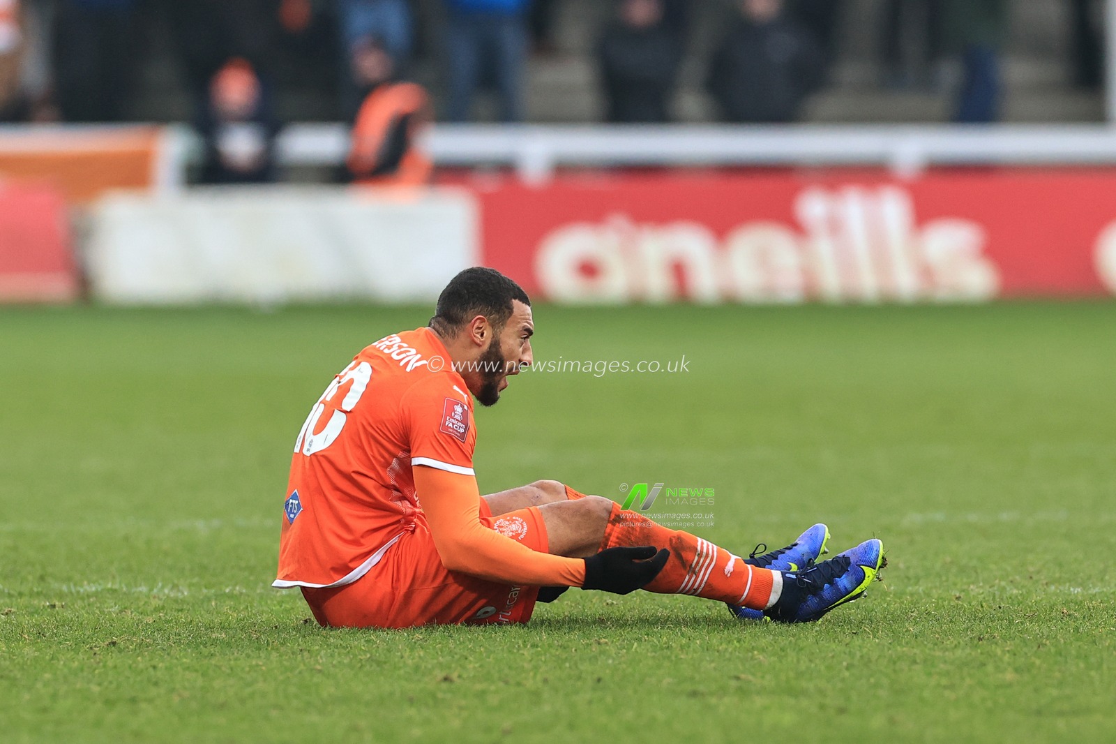 Keshi Anderson #10 of Blackpool receives an injury