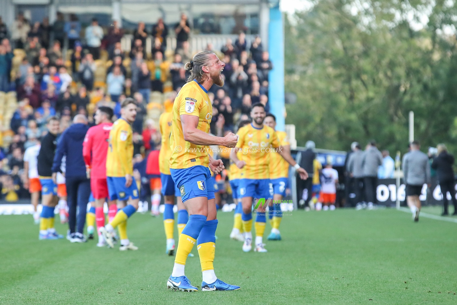 Alfie Kilgour of Mansfield Town celebrates his teams win after the Sky Bet League 1 match Mansfield Town vs Blackpool at One Call Stadium, Mansfield, United Kingdom, 5th October 2024

(Photo by Gareth Evans/News Images)