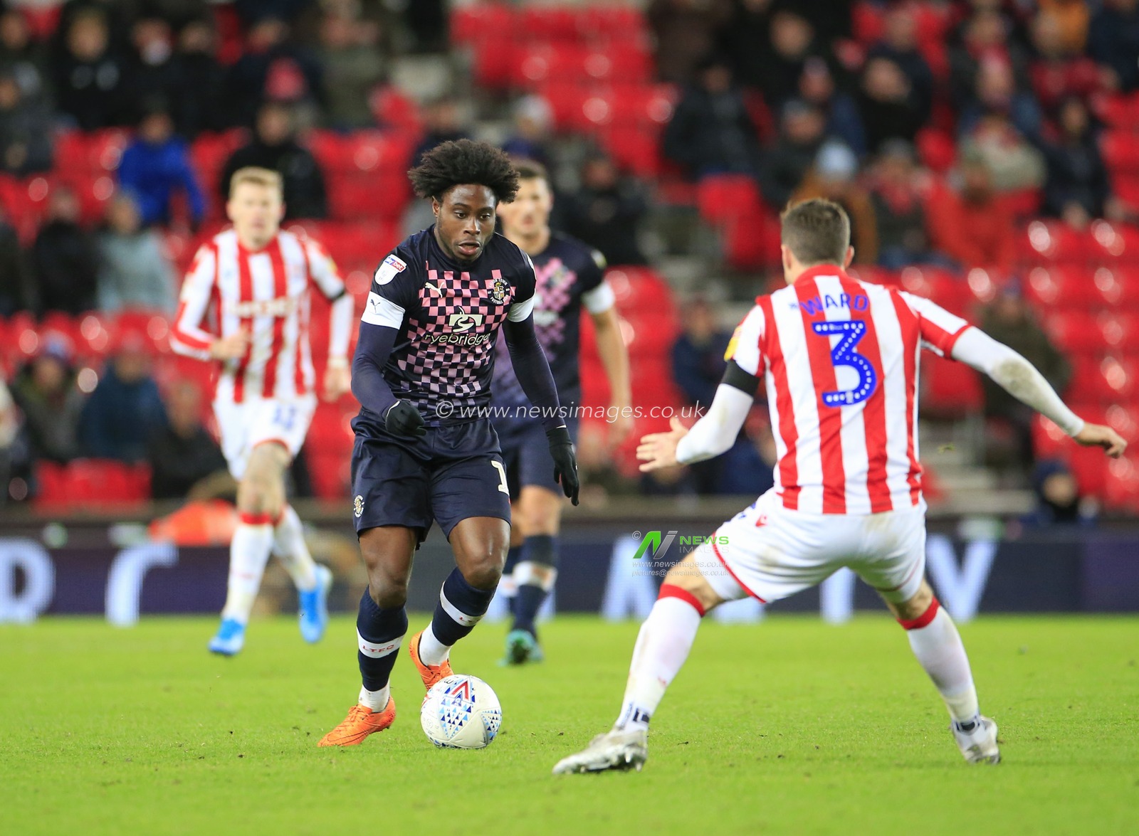 10th December 2019, Bet365 Stadium, Stoke-on-Trent, England; Sky Bet Championship, Stoke City v Luton Town : Pelly Ruddock (17) of Luton Town is confronted by Stephen Ward (3) of Stoke City

Credit: Conor Molloy/News Images