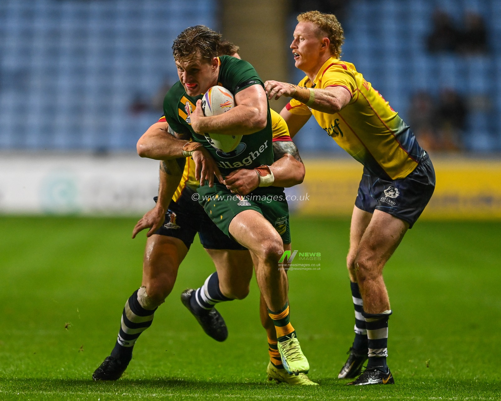 Cameron Munster of Australia is tackled by Kane Linnett of Scotland during the Rugby League World Cup 2021 match Australia vs Scotland at Coventry Building Society Arena, Coventry, United Kingdom, 21st October 2022

(Photo by Craig Thomas/News Images)