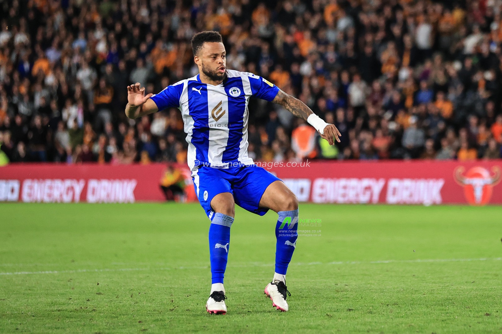 Jordan Cousins #6 of Wigan Athletic celebrates scoring the match winning penalty