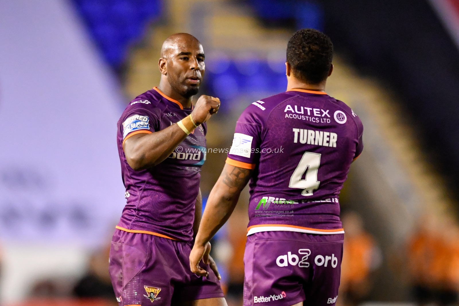 Michael Lawrence (13) of Huddersfield Giants offers a fist bump to Jordan Turner (4) at the end of the game