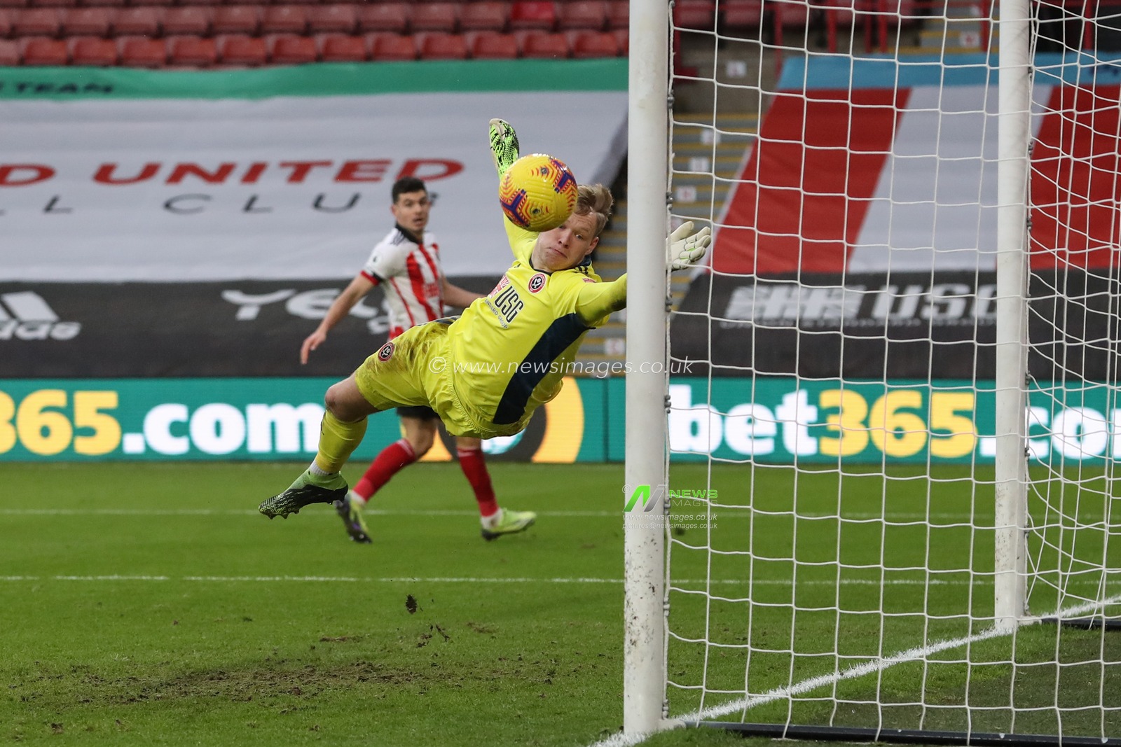 Tanguy NDombele #28 of Tottenham Hotspur puts the ball past Aaron Ramsdale #1 of Sheffield United as he scores to make it 1-3