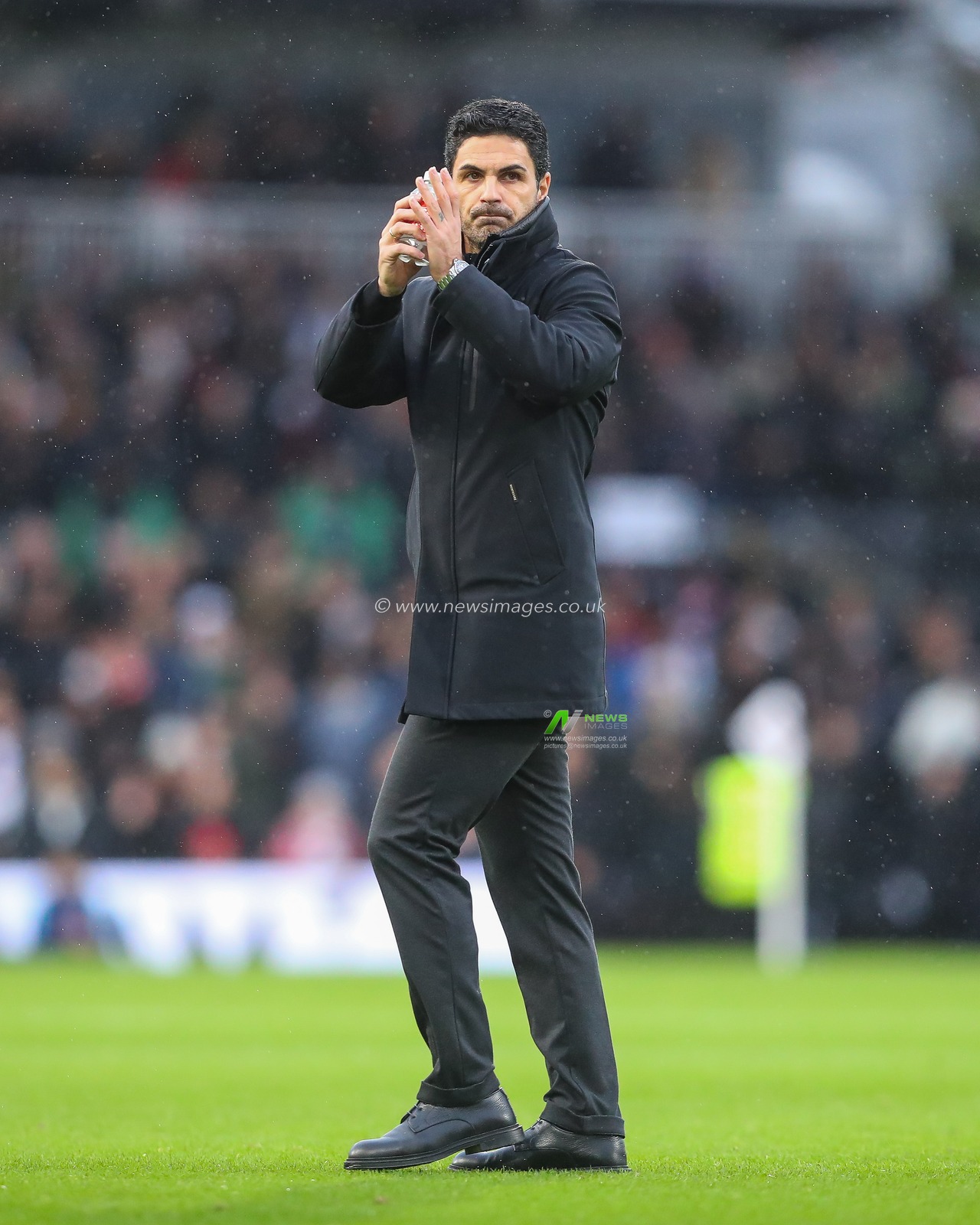 Mikel Arteta Manager of Arsenal applauds the fans ahead of the Premier League match Fulham vs Arsenal at Craven Cottage, London, United Kingdom, 8th December 2024

(Photo by Gareth Evans/News Images)