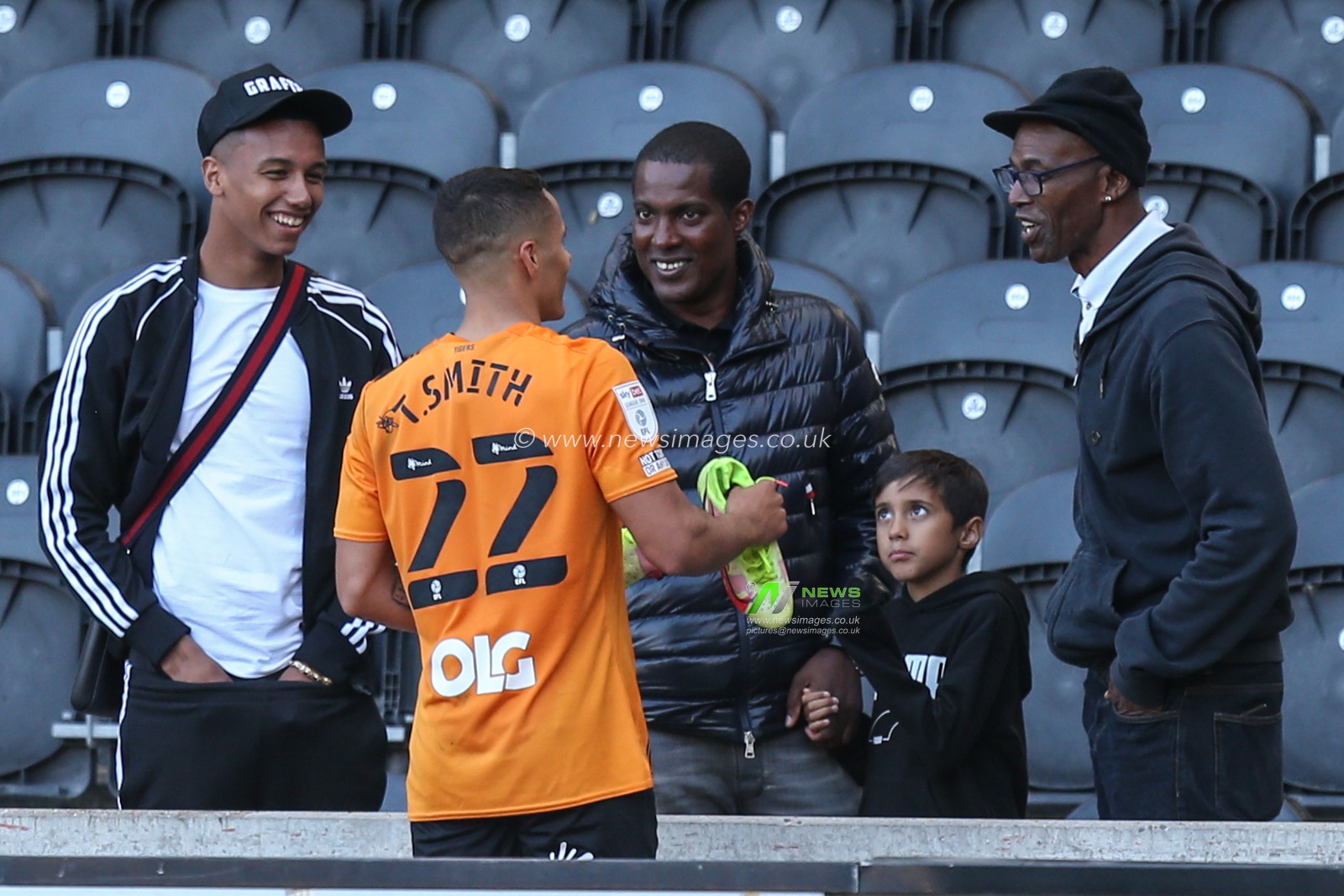 Tyler Smith #22 of Hull City speaks to friends after the final whistle