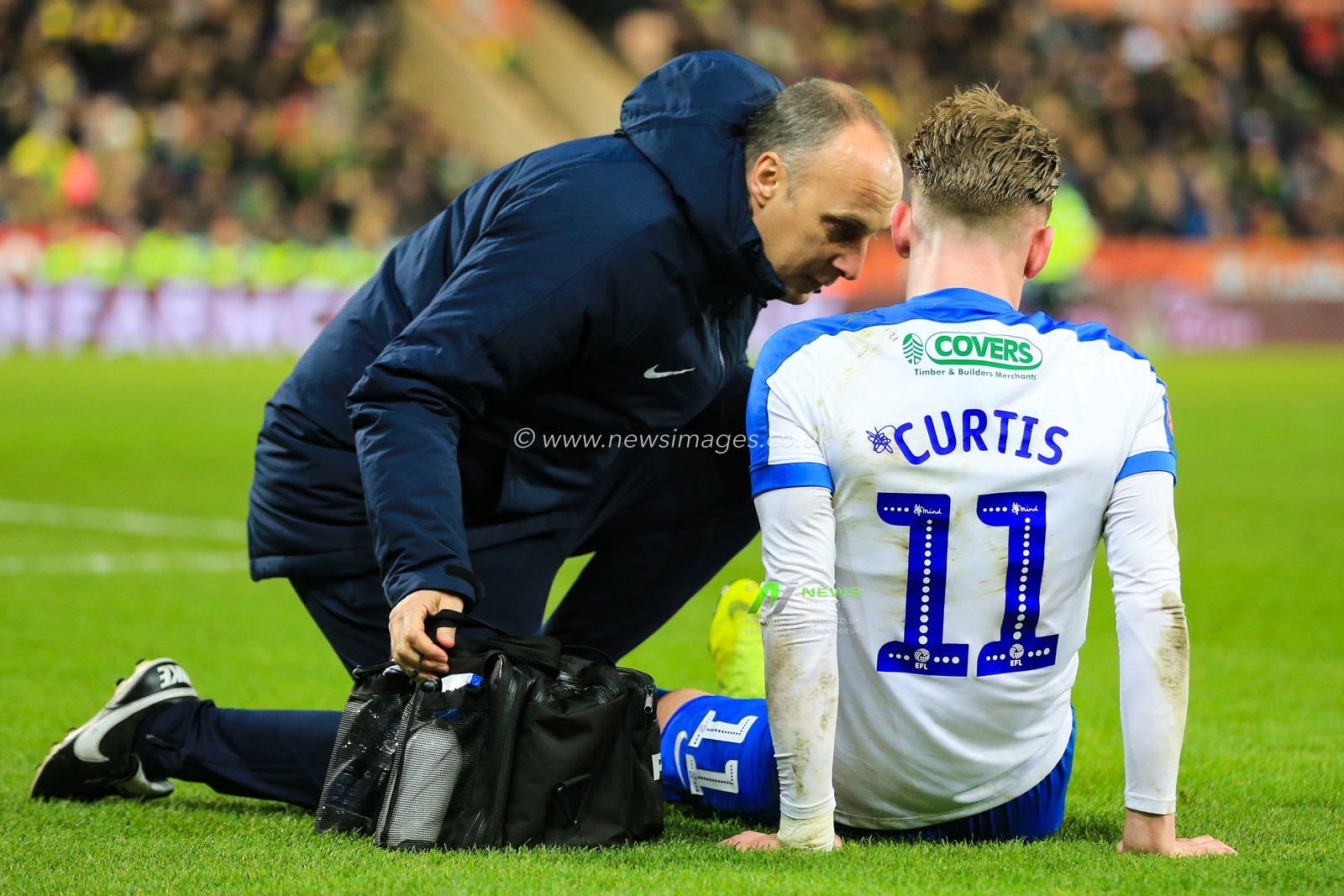 5th January 2019, Carrow Road, Norfolk, England; The Emirates FA Cup, 3rd Round, Norwich City vs Portsmouth ;  Ronan Curtis (11) of Portsmouth receives medical attention

Credit: Georgie Kerr/News Images

English Football League images are subject to DataCo Licence