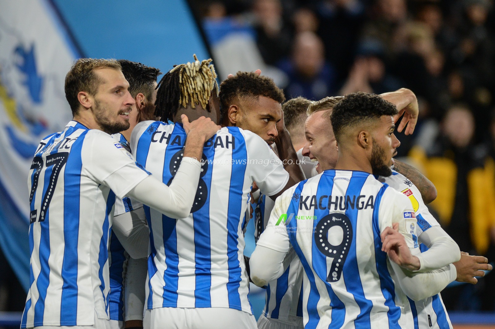21st December 2019, John Smith's Stadium, Huddersfield, England; Sky Bet Championship, Huddersfield Town v Nottingham Forest : Huddersfield Town players mob goal scorer Steve Mounie, his goal makes it 2-0

Credit: Dean Williams/News Images